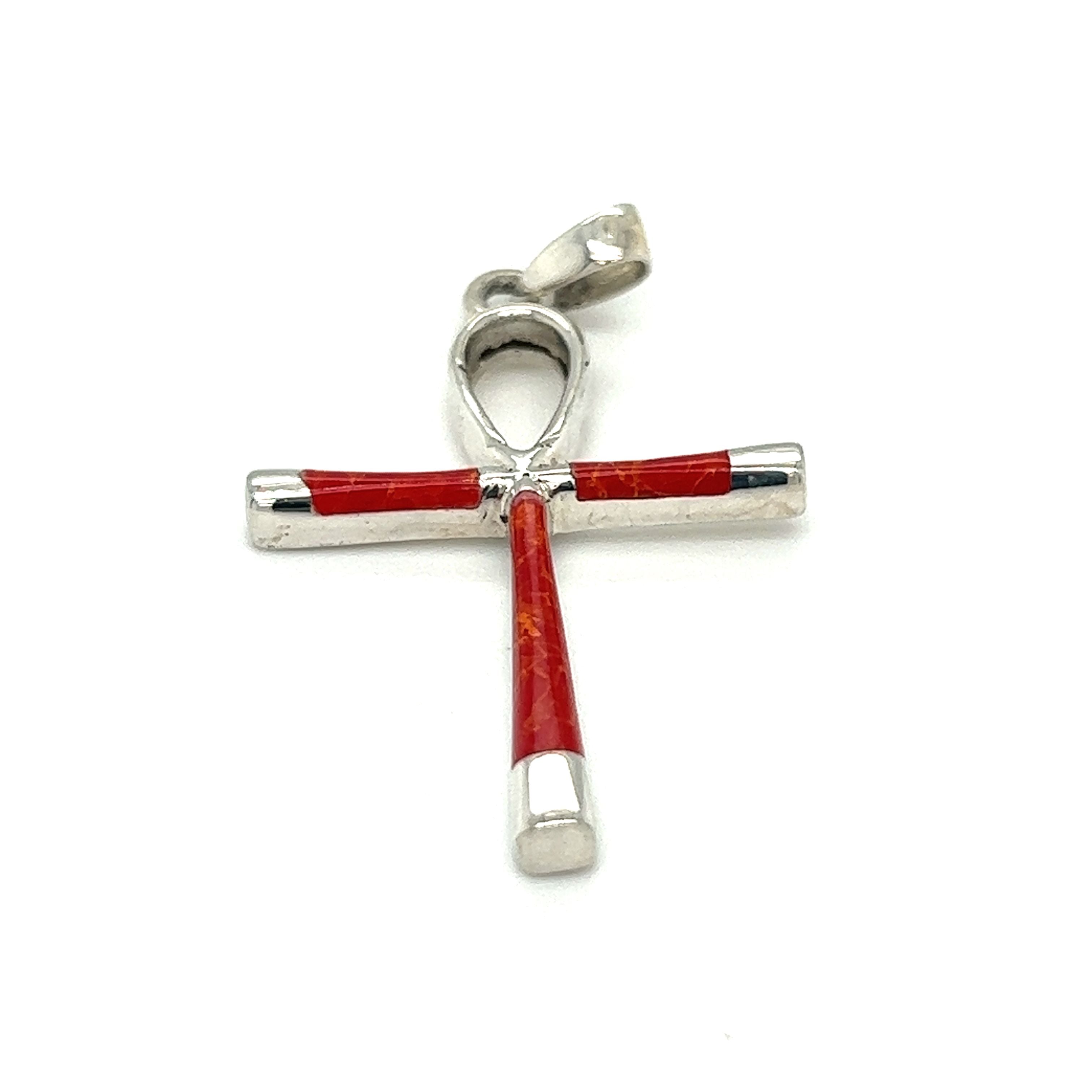 A stunning statement piece, this Super Silver Inlay Stone Ankh Pendant features intricate detailing and is beautifully crafted with red wood, paying homage to the ancient Egypt era.