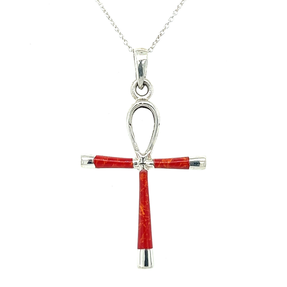
                  
                    A stunning statement piece inspired by ancient Egypt, featuring a Super Silver Inlay Stone Ankh Pendant crafted with brilliant red coral and sterling silver.
                  
                