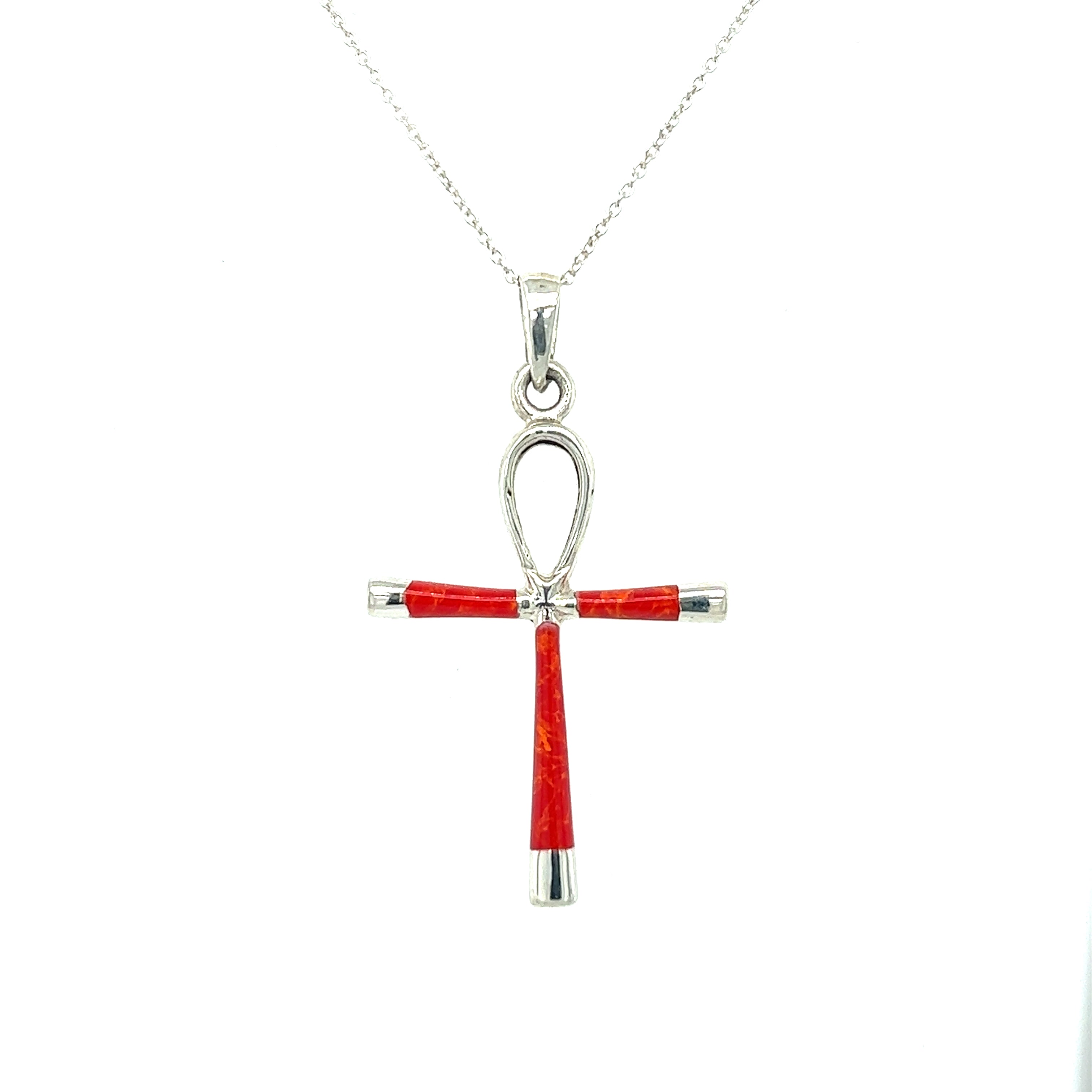 A statement piece, this Super Silver Inlay Stone Ankh Pendant combines the symbolism of ancient Egypt with the vibrant red coral and sleek sterling silver design.