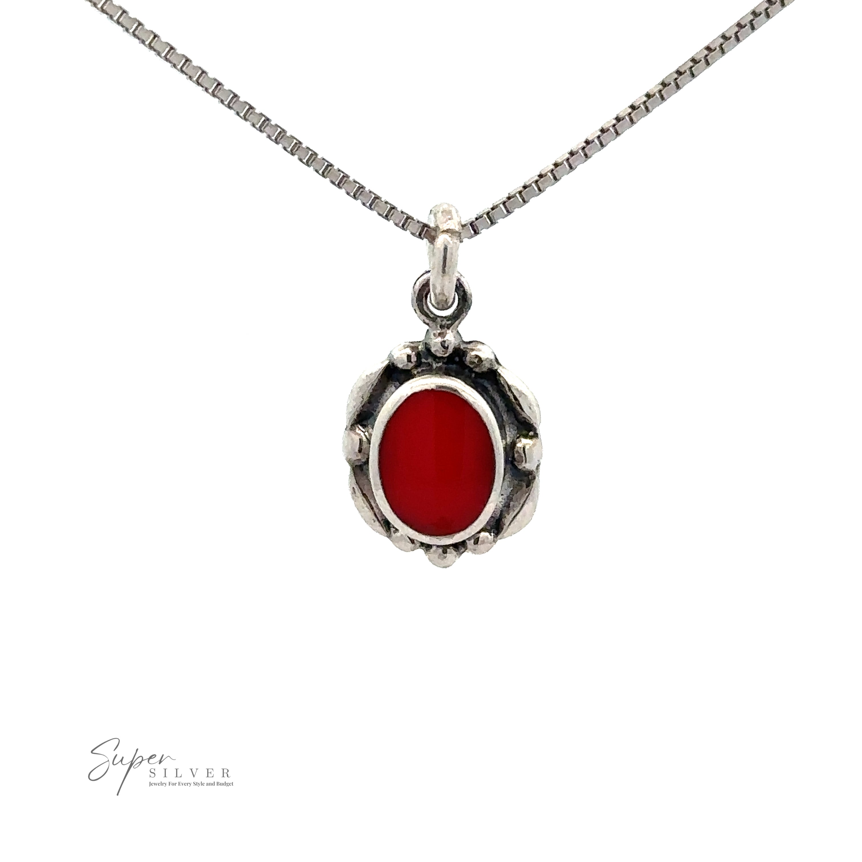 Beautiful Oval Stone Pendant With Silver Border: A silver necklace with an oval red gemstone pendant, featuring a beaded border design. The thin chain is crafted in sterling silver with a box chain style.