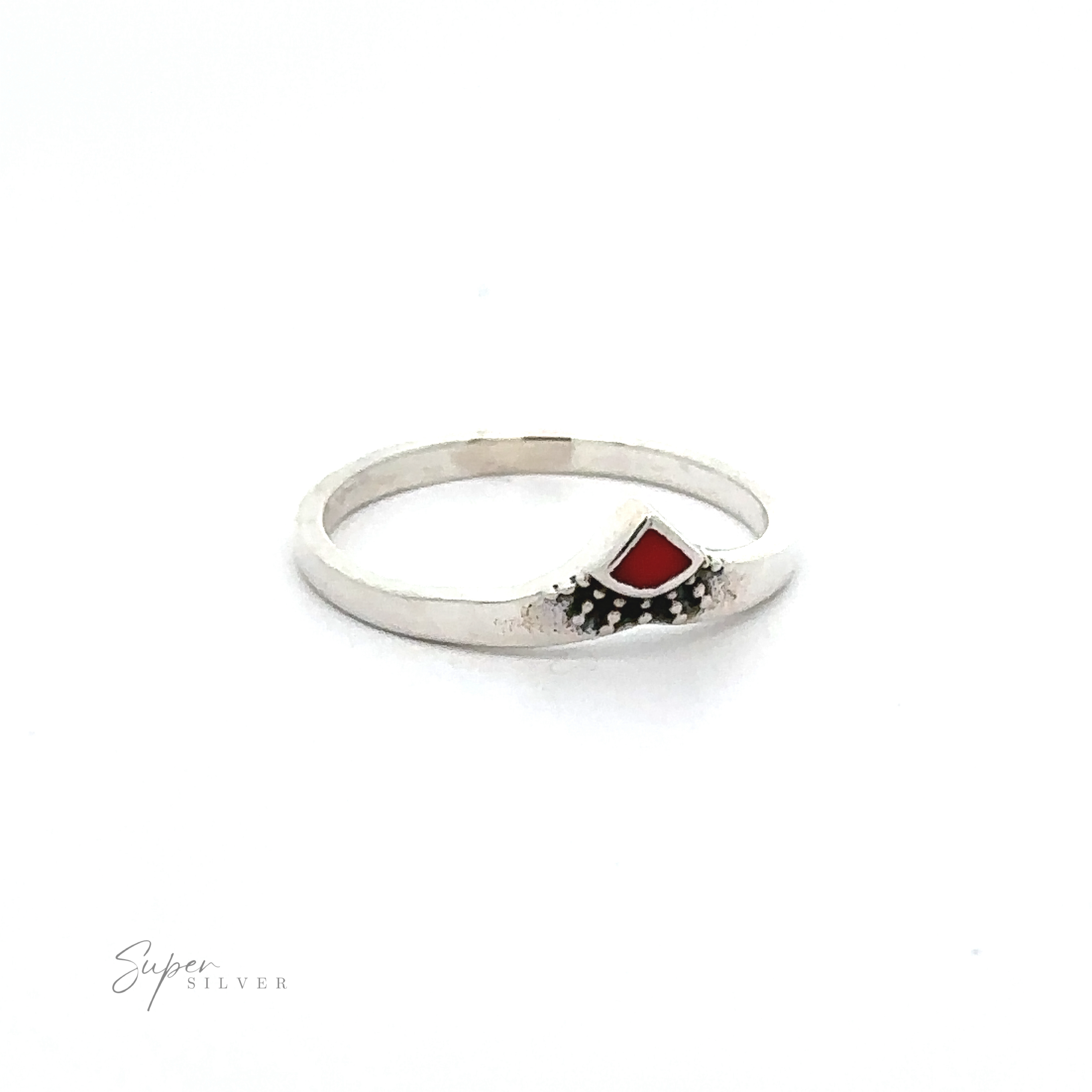 A Dainty Chevron Bali Style Inlay Ring with a red stone in the middle.