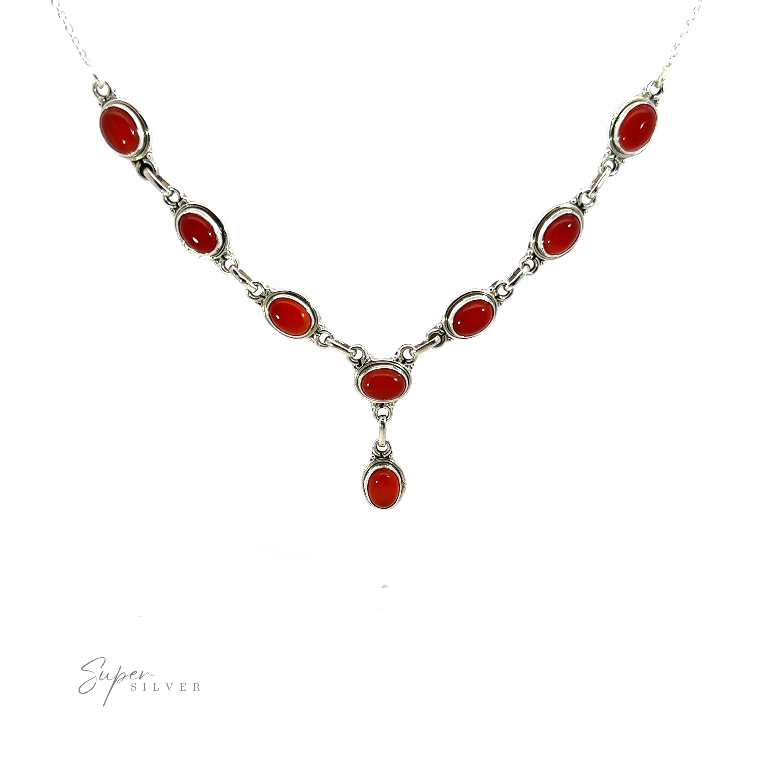 A Simple Oval Y Necklace with Gemstones with red oval gemstones set in silver on a white background, featuring a bohemian charm with a Y-shaped drop pendant. "Super Silver" text is displayed in the lower left corner.