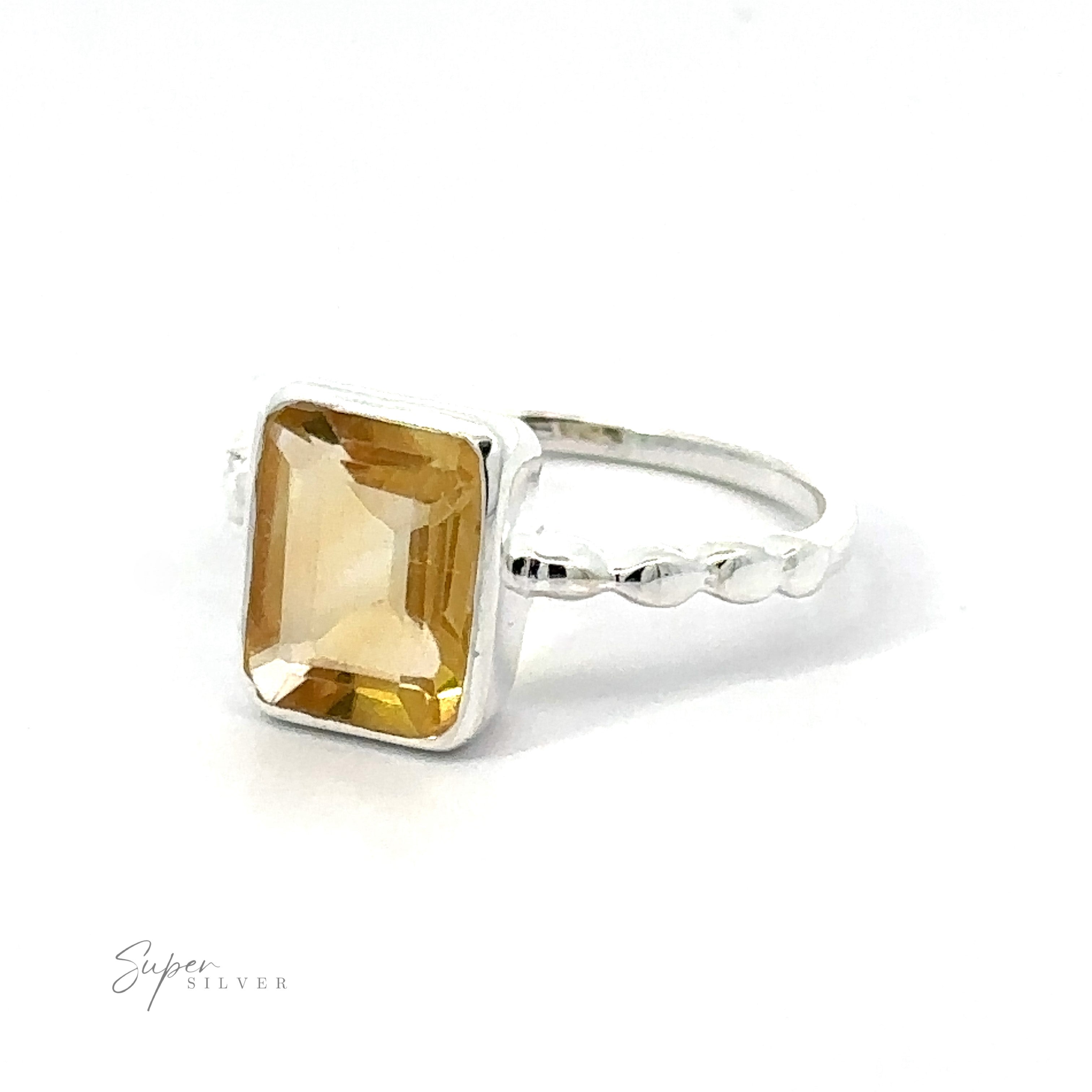 A Rectangle Gemstone Ring with Beaded Band, made of .925 Sterling Silver and featuring a large rectangular yellow gemstone, set on a twisted band, displayed against a white background.