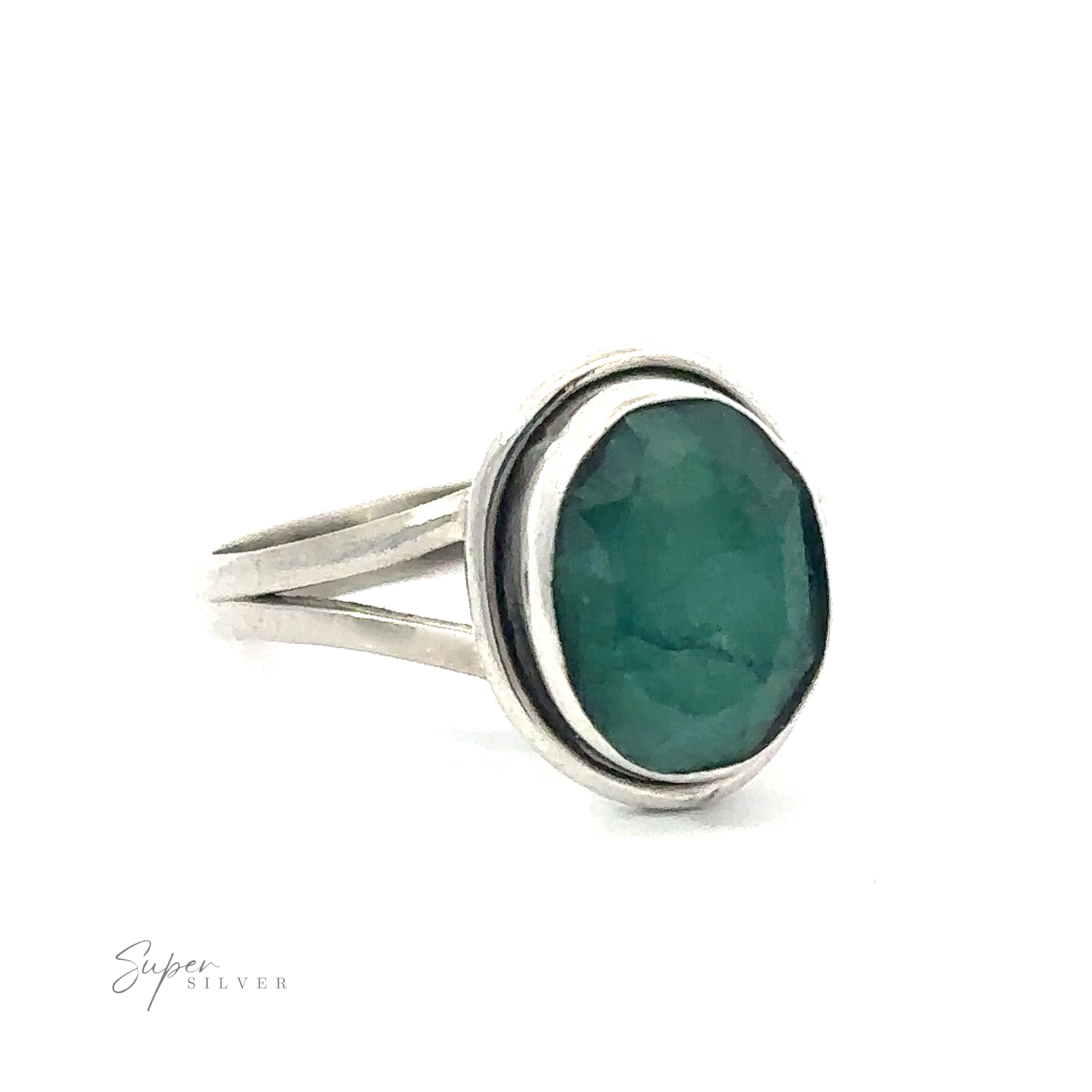 Oval split shank stone ring with a round green emerald.