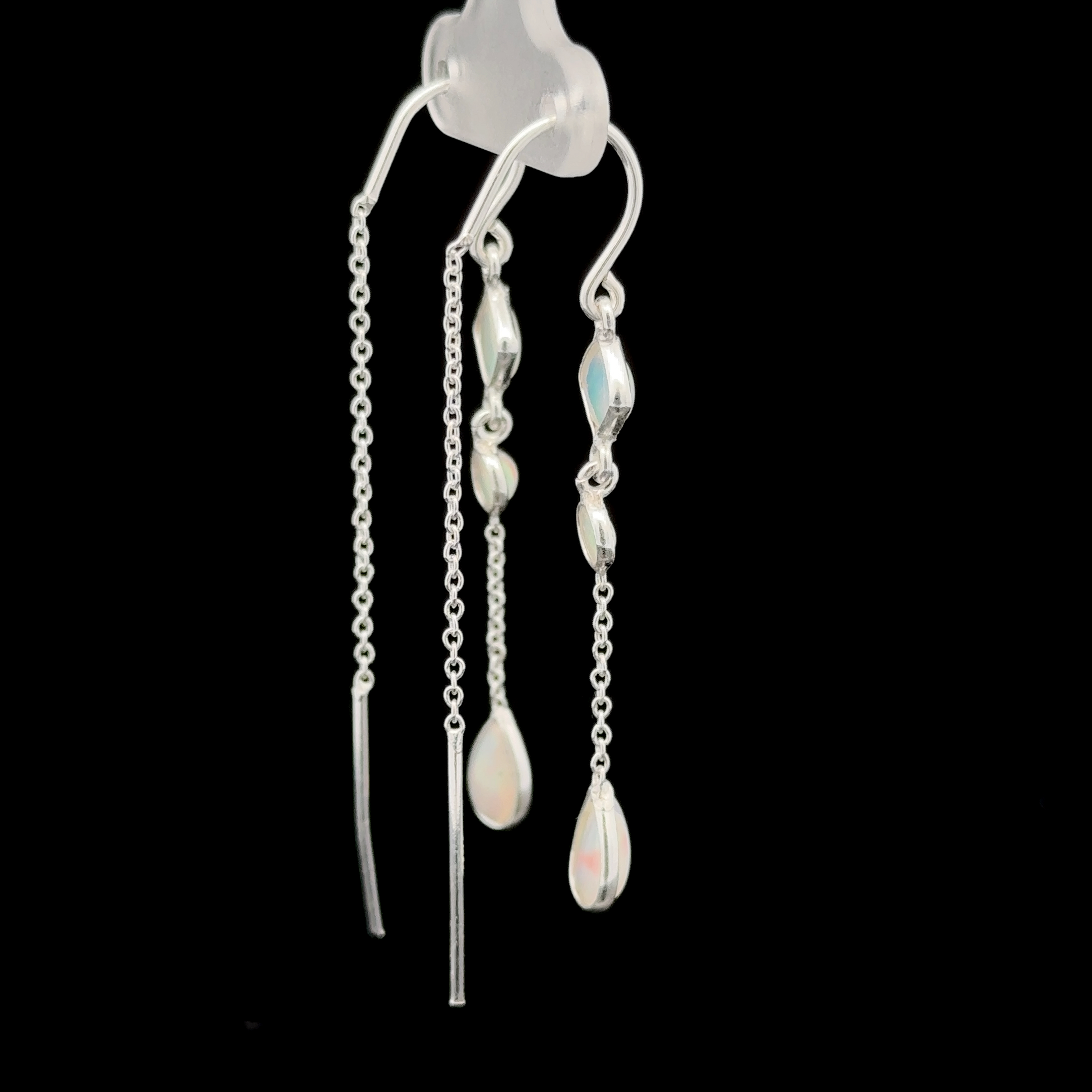 Ethiopian Opal Threader Earrings feature a mix of hanging chains and teardrop bead accents against a black background.