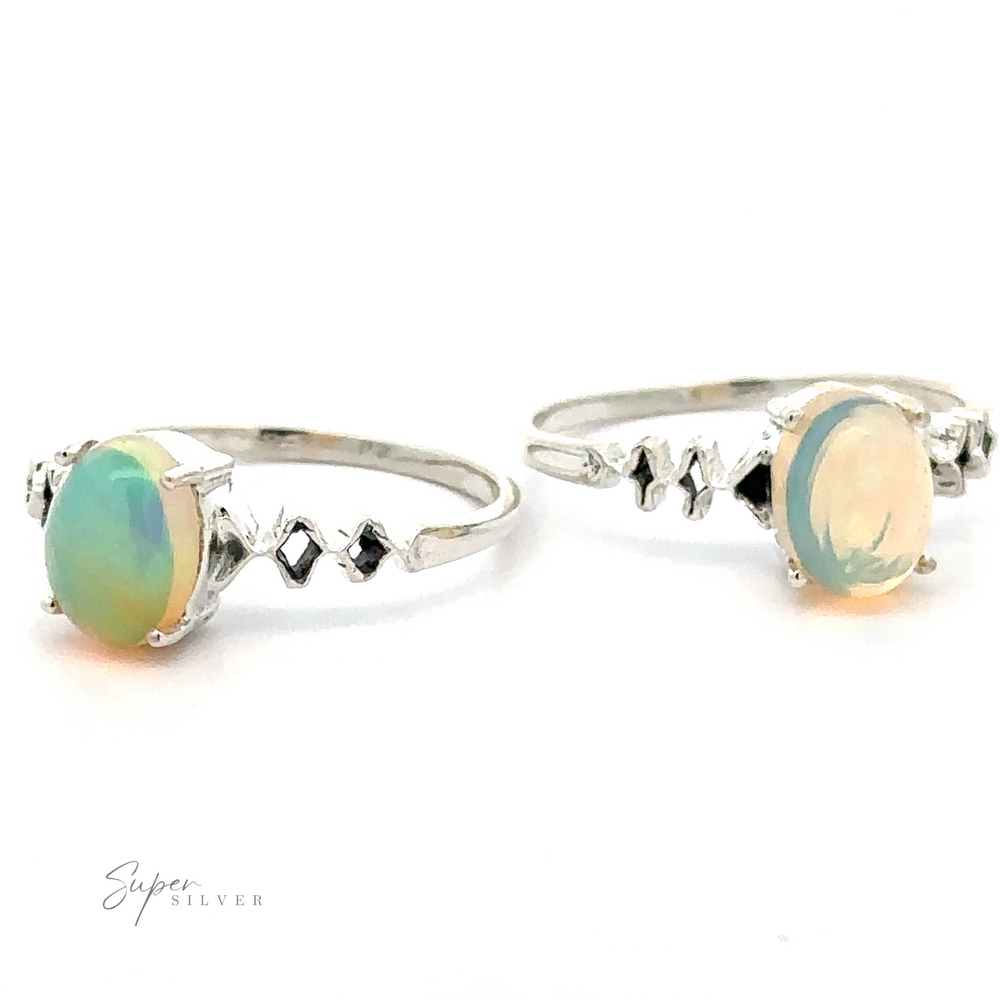 Two sterling silver rings with Pronged Ethiopian Opal with Diamond Pattern stones, displaying different angles on a white background. The band of one ring features zigzag patterns.