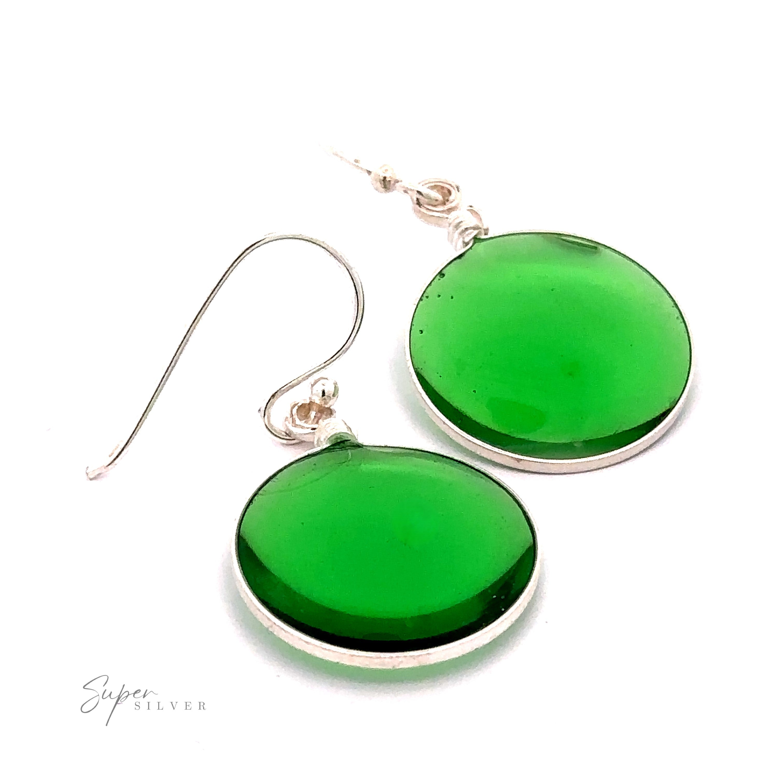 A simple set of Round Glass Earrings with silver hooks, each featuring a smooth, glossy green surface set in a thin .925 Sterling Silver rim. The image includes the text "Super Silver" in the bottom left corner.