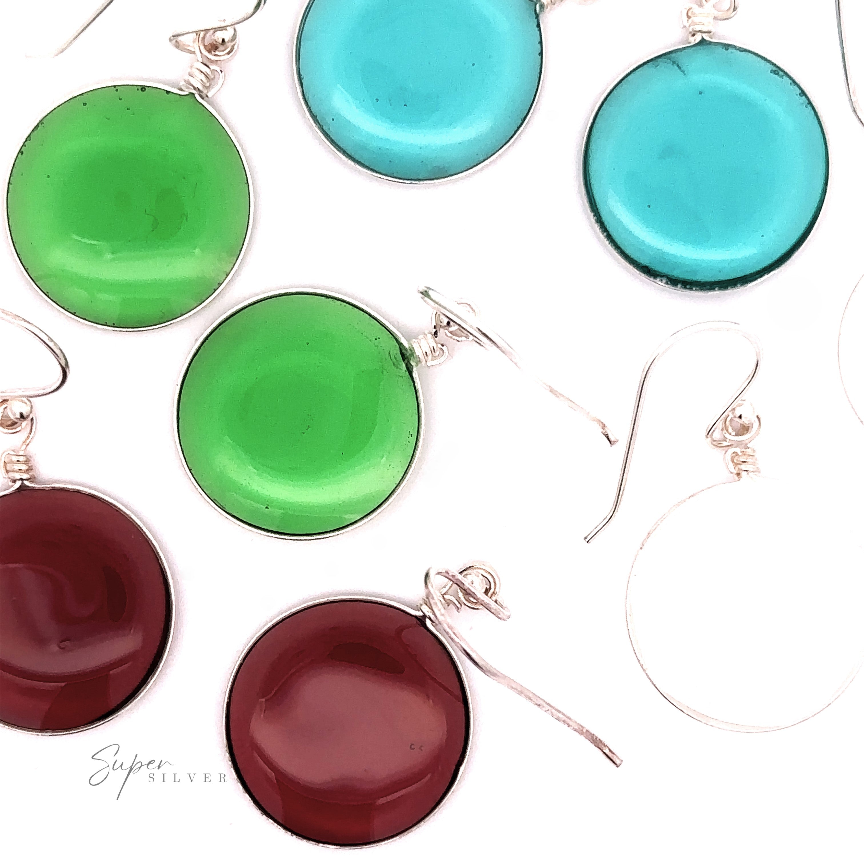 A simple set of Round Glass Earrings in shades of green, blue, and red, each with .925 Sterling Silver hooks, displayed against a white background.