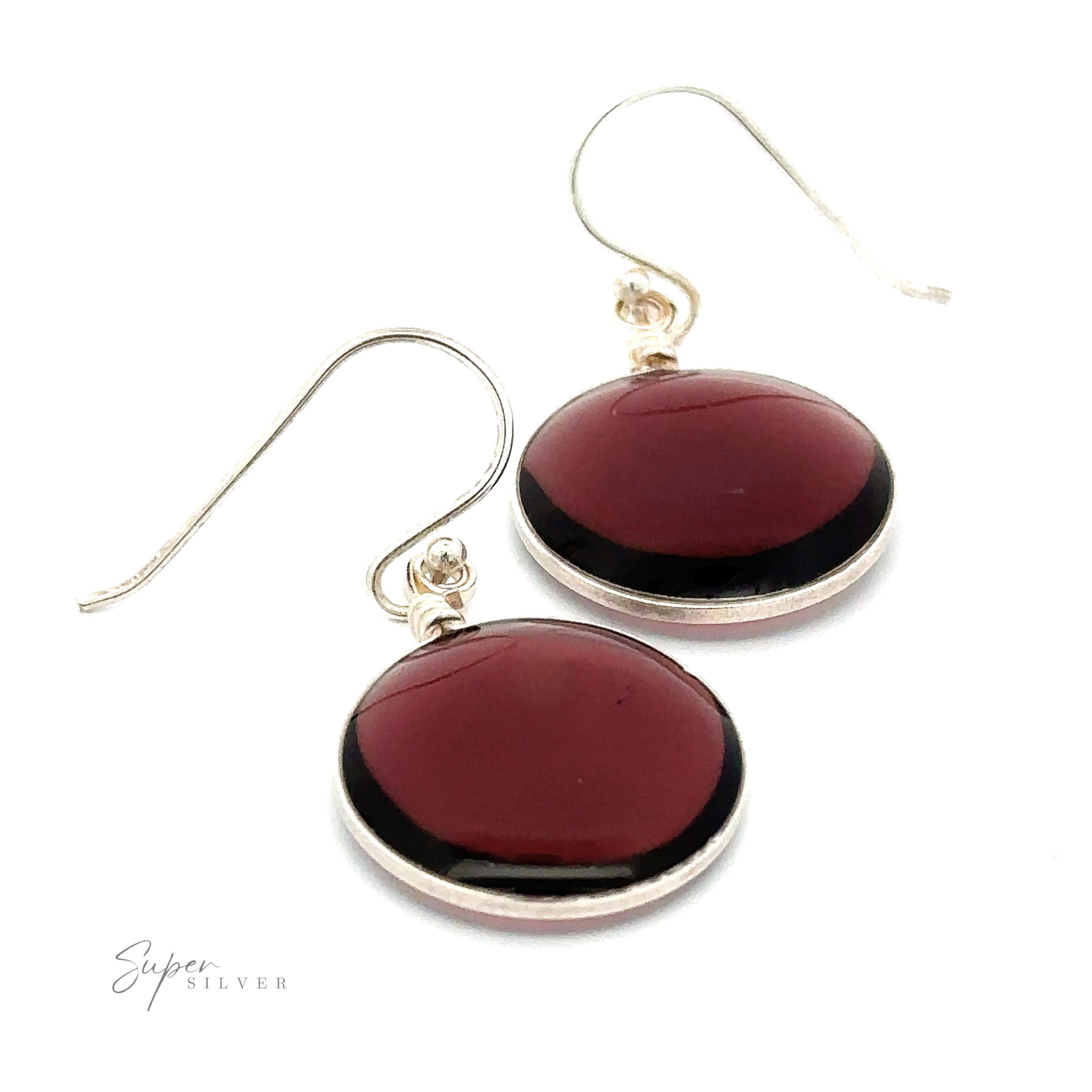 A simple set of Round Glass Earrings featuring large round red stone pendants and hook fastenings.