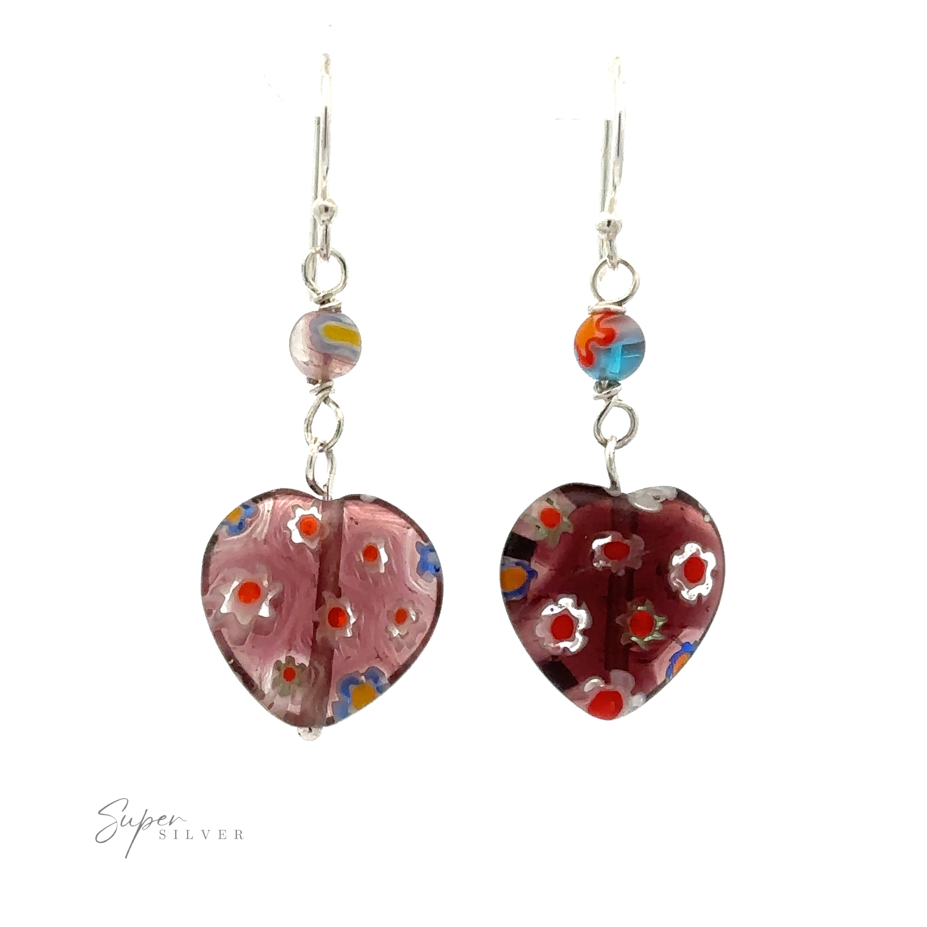 A pair of Beaded Resin Floral Heart Earrings with .925 Sterling Silver hooks, each featuring a heart-shaped glass pendant with multicolor flower detail. The left earring has a lighter pink heart, and the right a darker red one.