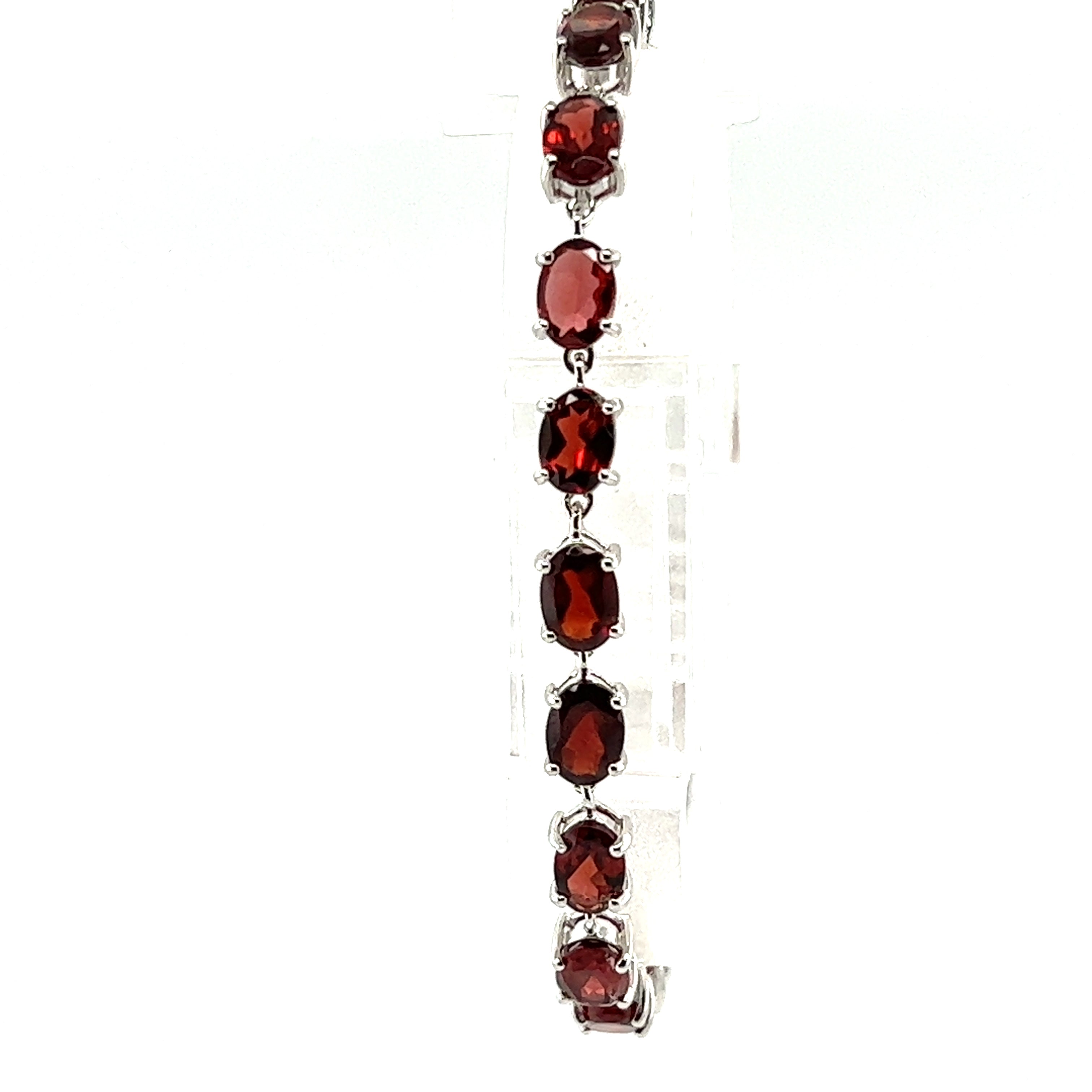 A Super Silver Pronged Garnet Bracelet With Rhodium Finish.