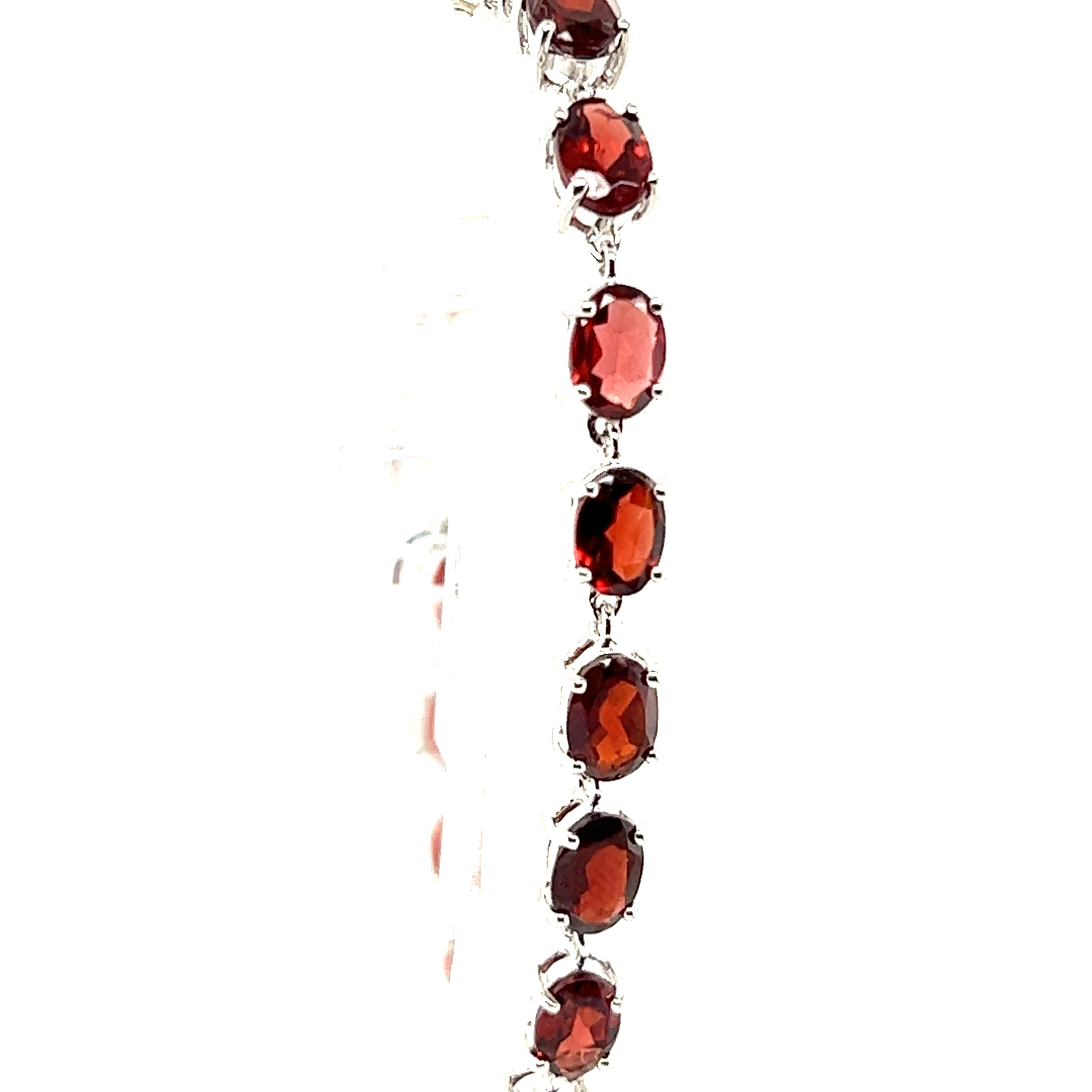 This Super Silver Pronged Garnet Bracelet features crimson garnet stones and a rhodium finish.