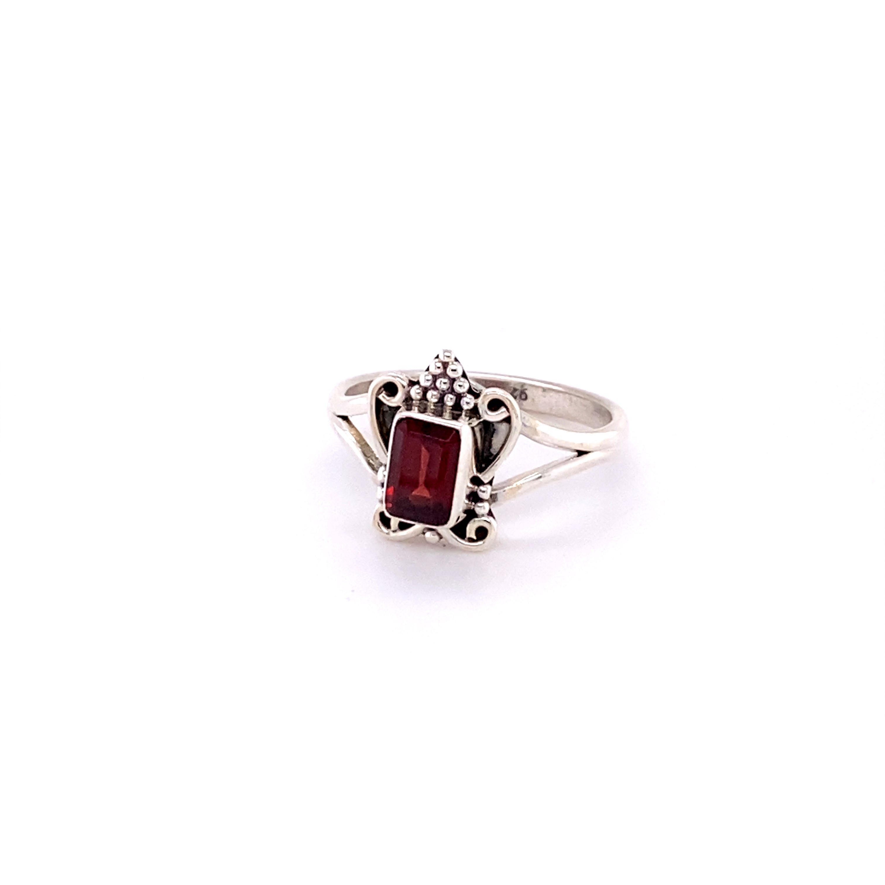 A Bohemian Princess Ring with an ornate design and a rectangular red gemstone set in the center, perfect for those seeking a Boho-style princess ring.