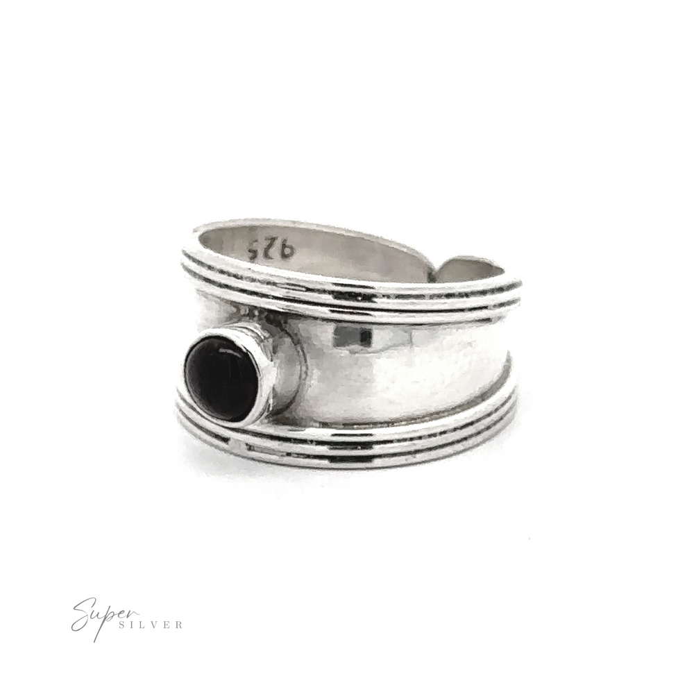 
                  
                    Adjustable Wide Cigar Band Toe Ring with Gemstone with a modern design featuring clean lines and a single black stone, displayed against a white background.
                  
                