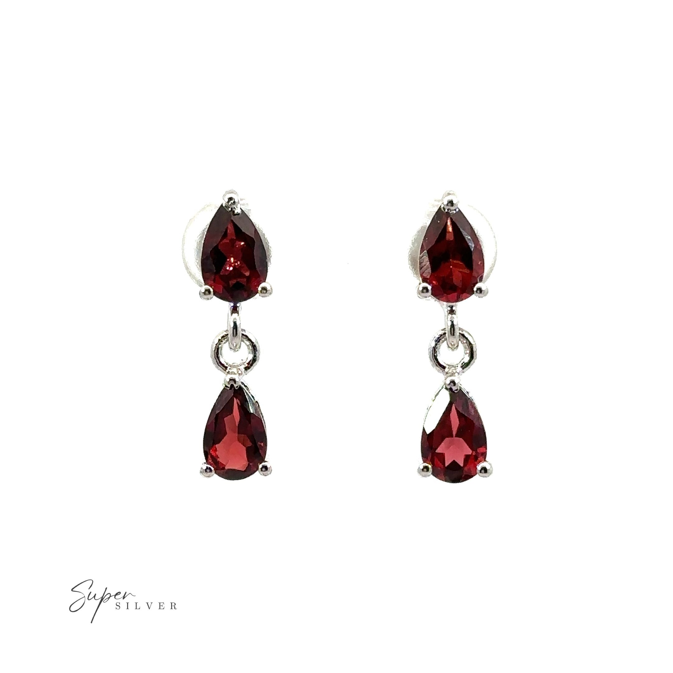 A pair of Elegant Faceted Gemstone Jewelry Set earrings on a white background, showcasing the sophistication of these exquisite gemstones.