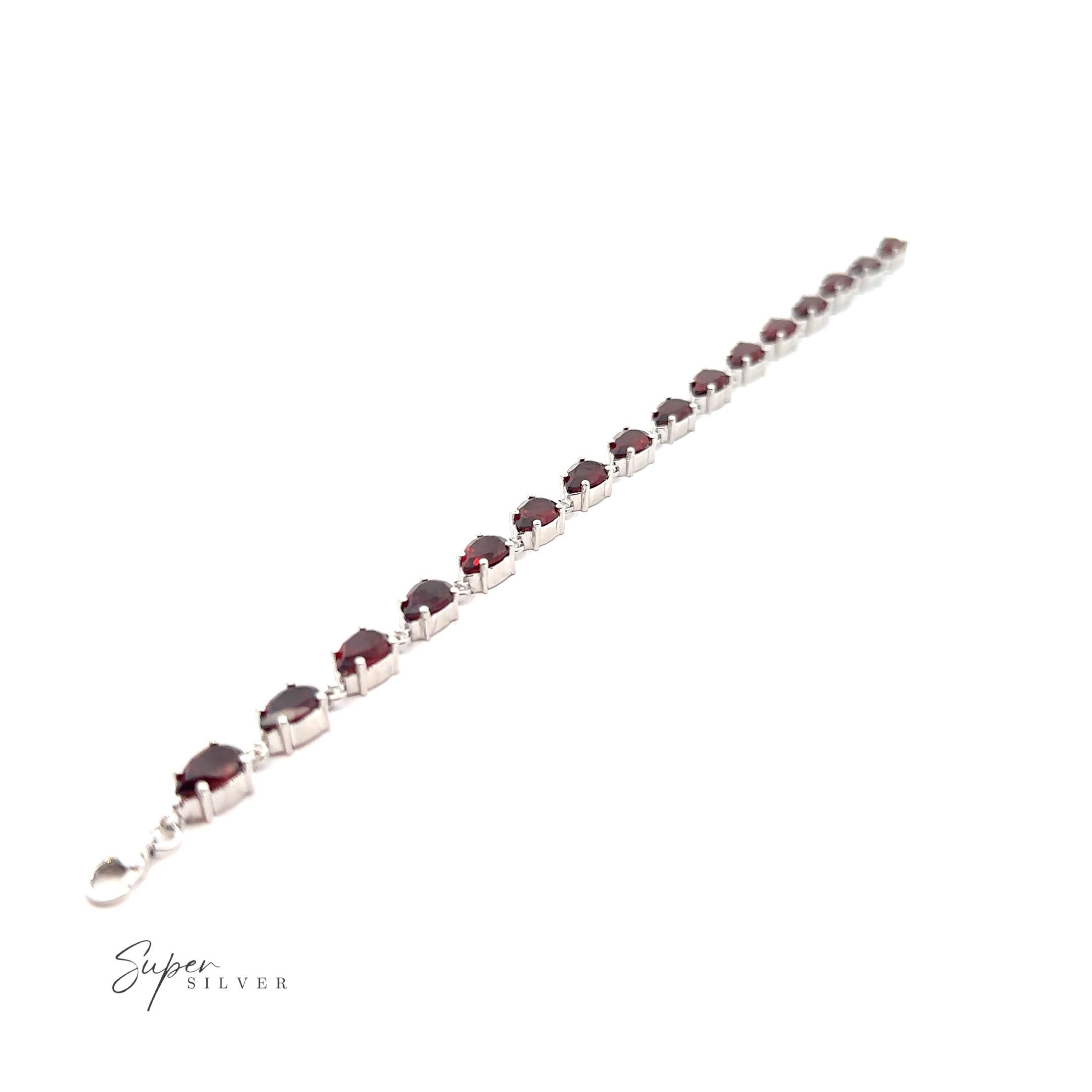 An elegant sterling silver bracelet adorned with the Elegant Faceted Gemstone Jewelry Set.