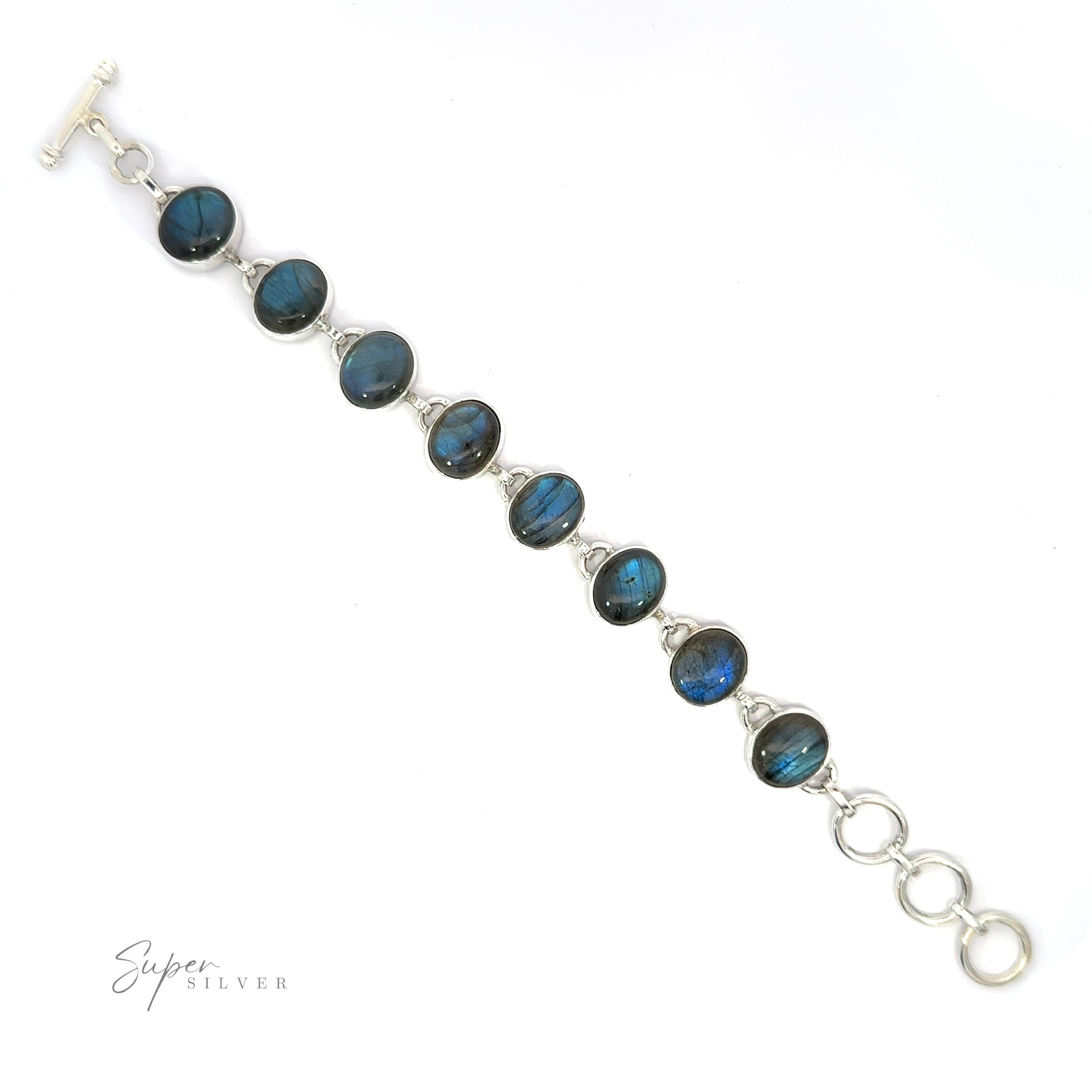 A silver Statement Oval Gemstone Bracelet featuring blue labradorite stones with a clasp closure, displayed against a white background.