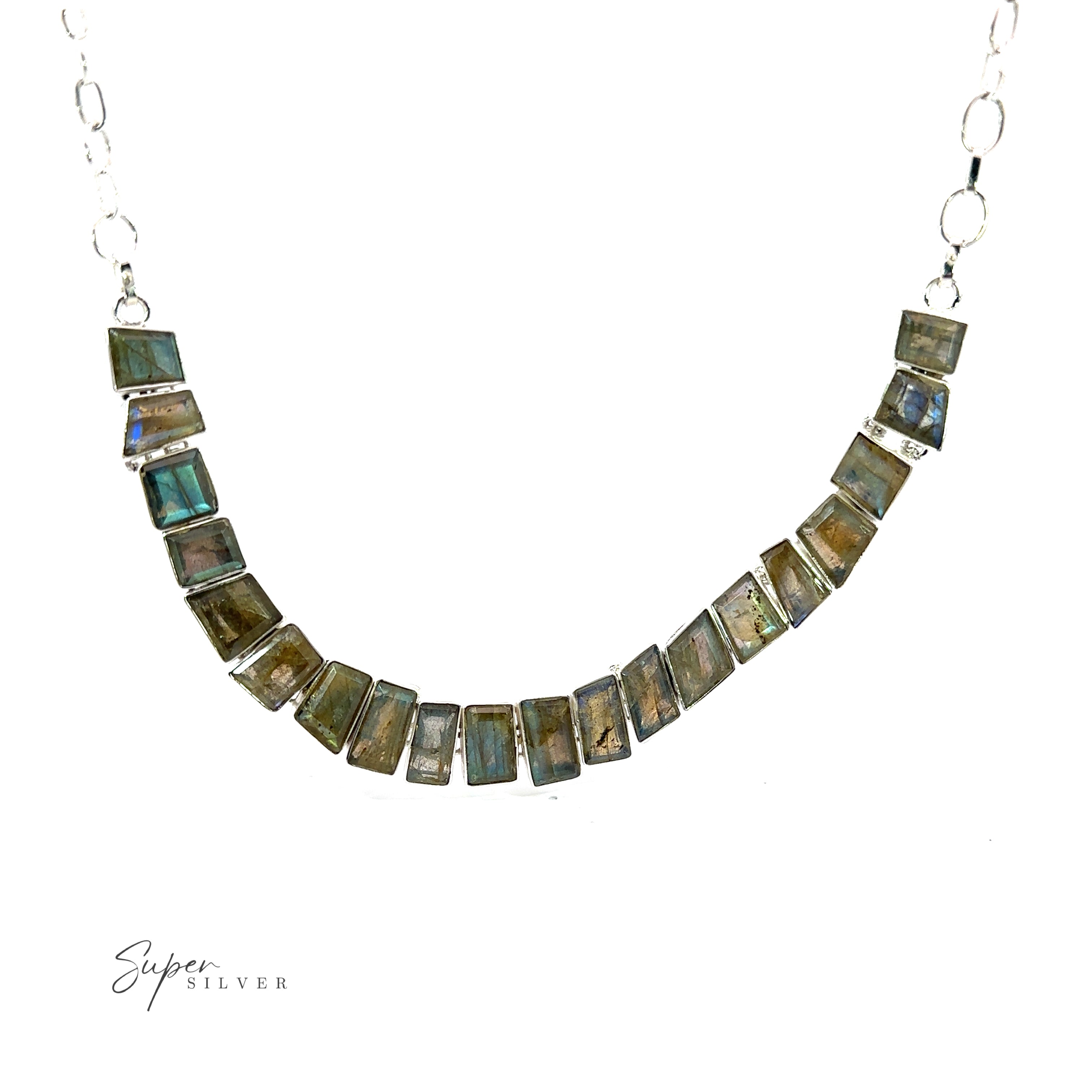 A Statement Gemstone Necklace featuring rectangular labradorite stones set in a silver chain is displayed on a plain white background. The logo "Super Silver" is visible in the lower left corner.