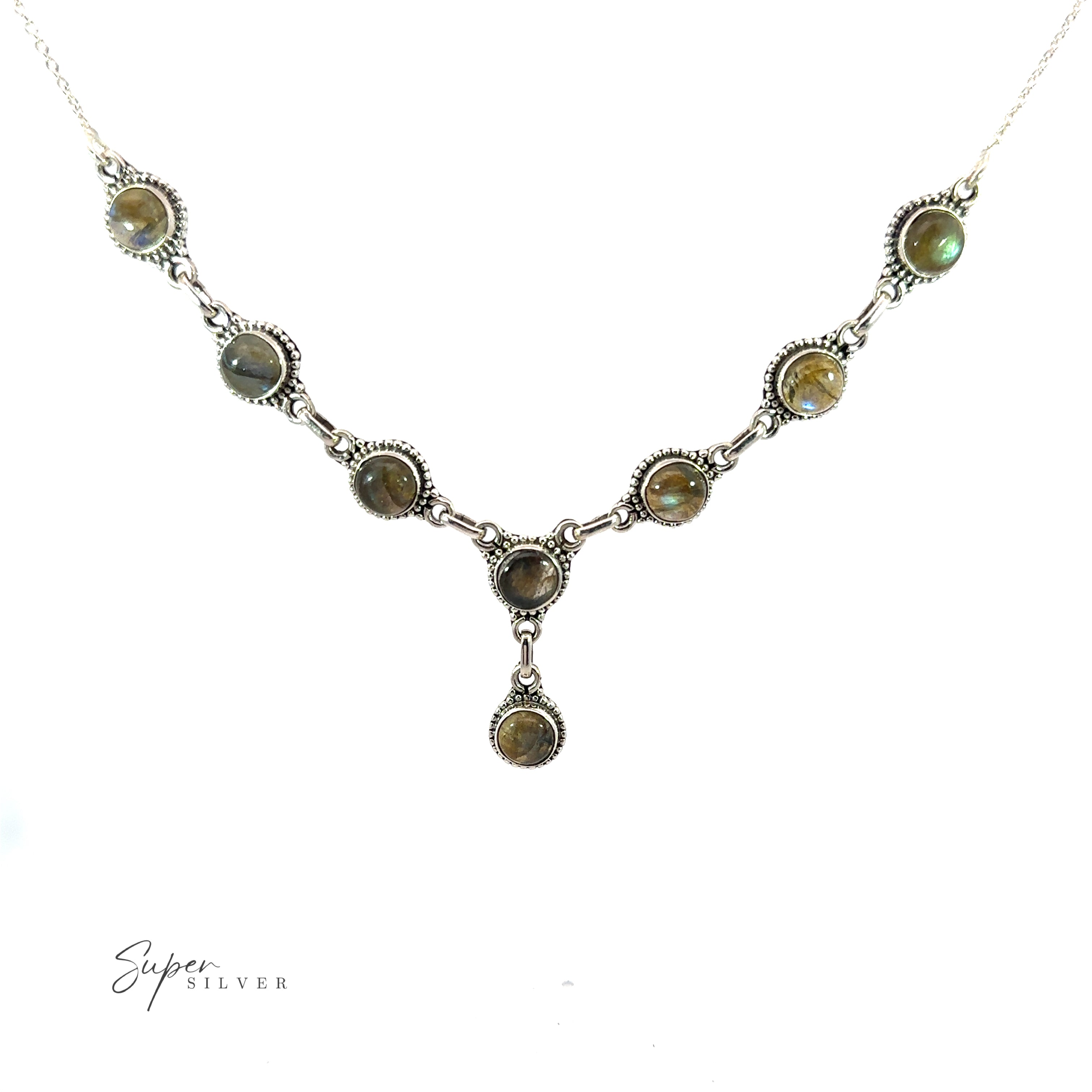 A Round Gemstone Y Necklace with Ball Border featuring a series of round, green gemstones linked together, with one gemstone hanging at the center. This bohemian style jewelry piece lies elegantly on a white background.