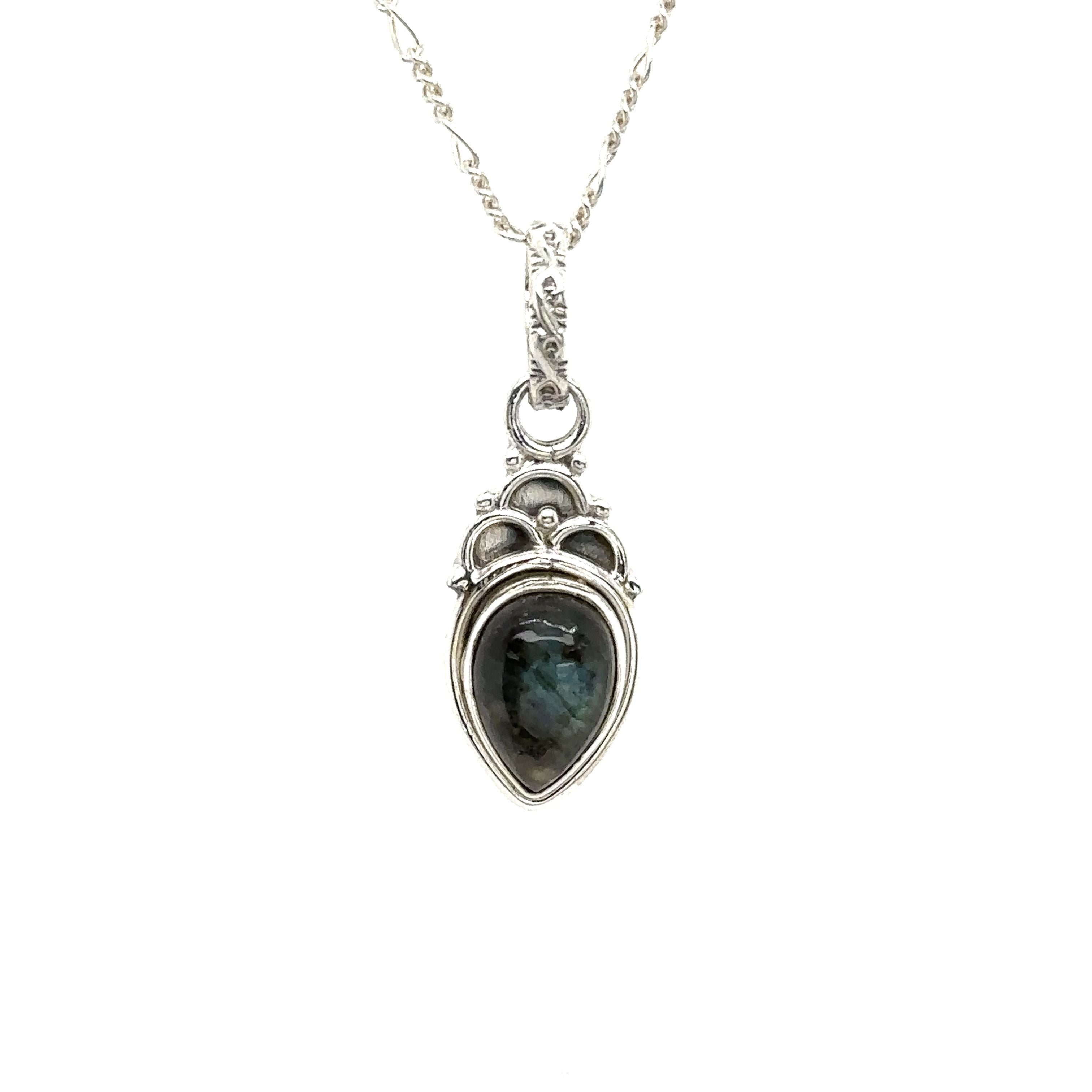 A boho-inspired Dainty Gemstone Teardrop Pendant with a labradorite stone, showcasing free-spirited elegance.