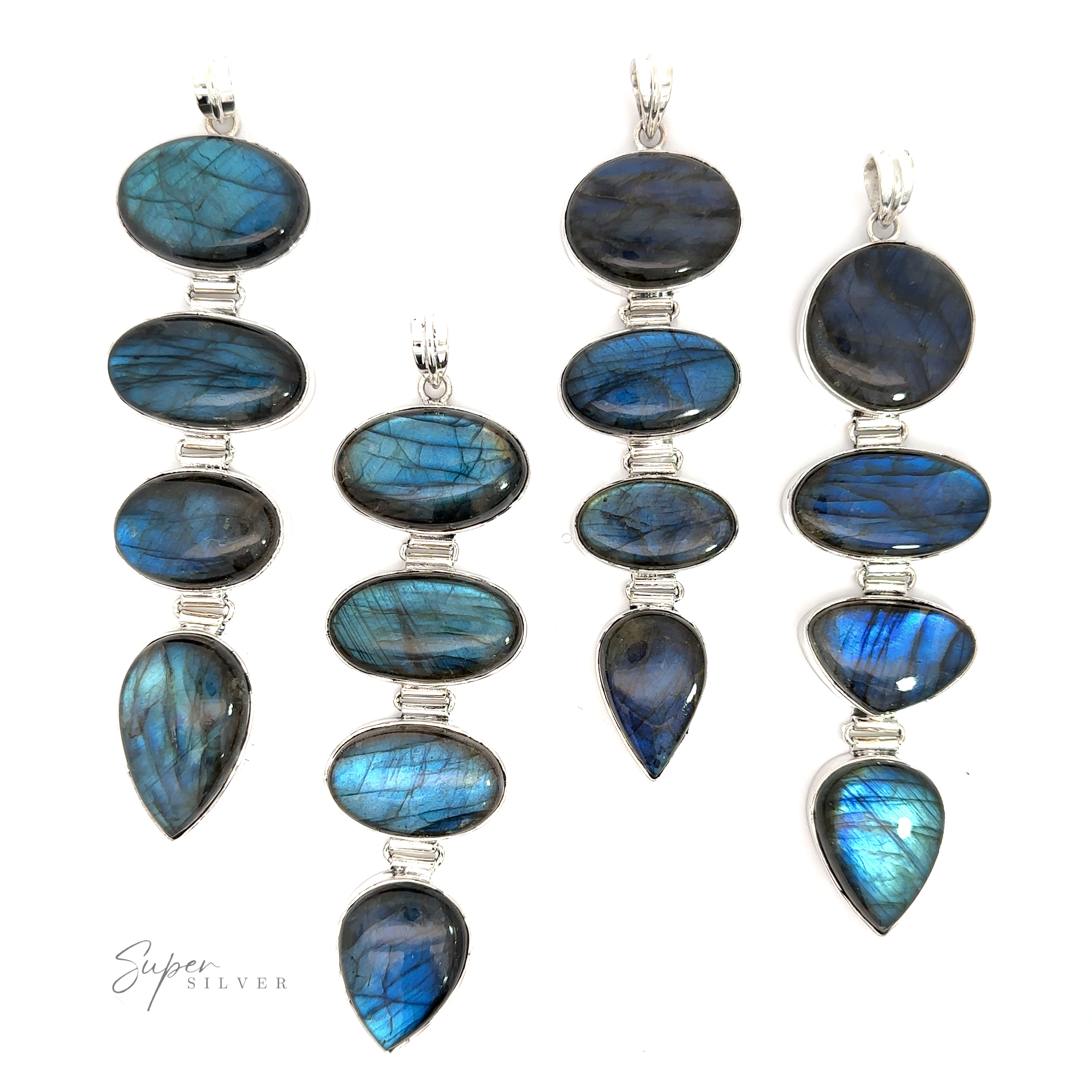 Four tiered statement labradorite pendants on a white background, radiating enchantment.