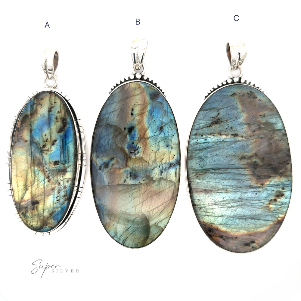 Three XL Statement Oval Labradorite Pendants labeled A, B, and C, each with unique iridescent patterns, displayed against a white background.
