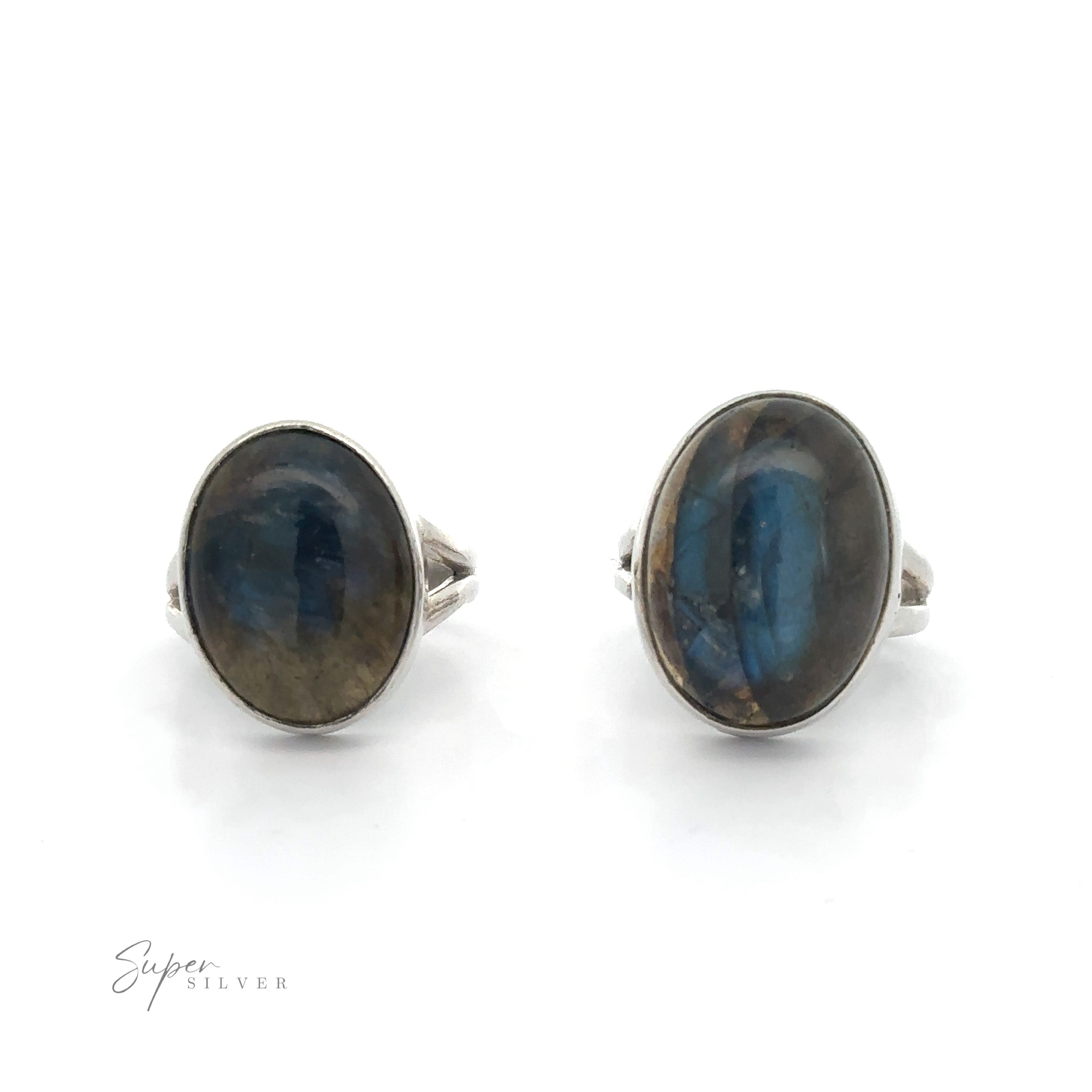 A pair of sterling silver rings with Heavy Oval Labradorite gemstones on a white background.