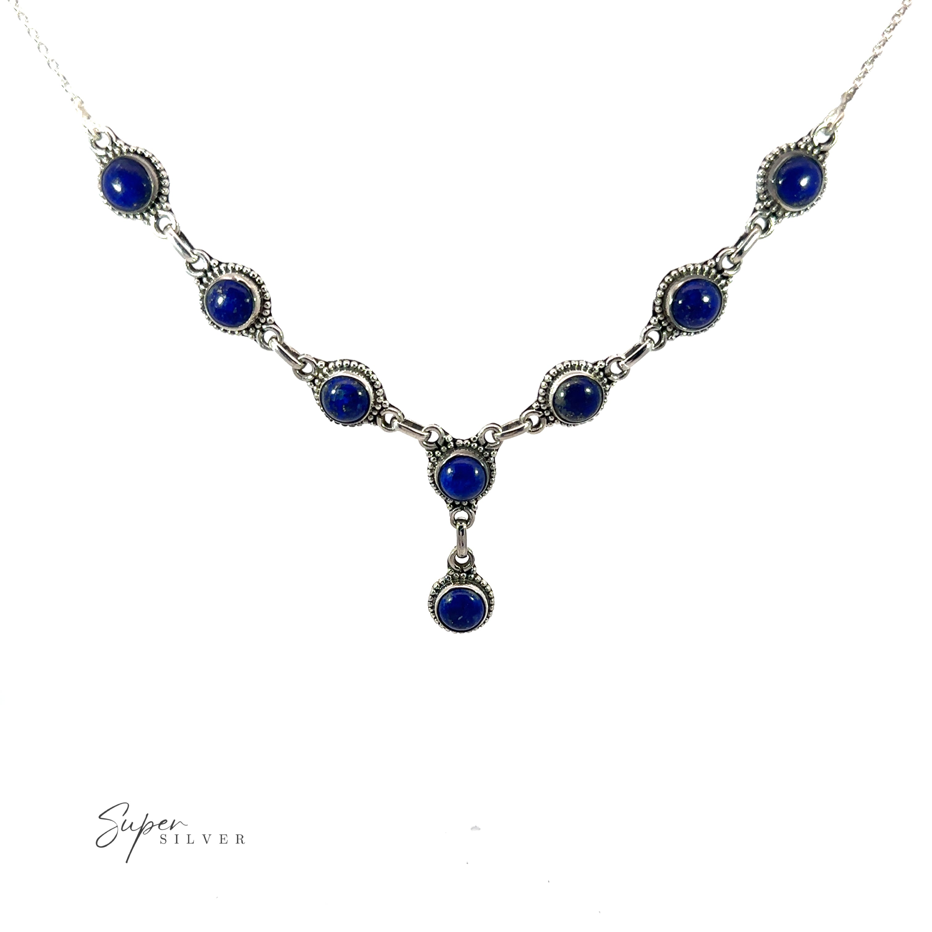 This Round Gemstone Y Necklace with Ball Border features a symmetrical design with multiple round blue gemstones and an additional gemstone hanging from the center, embodying the essence of bohemian style jewelry.
