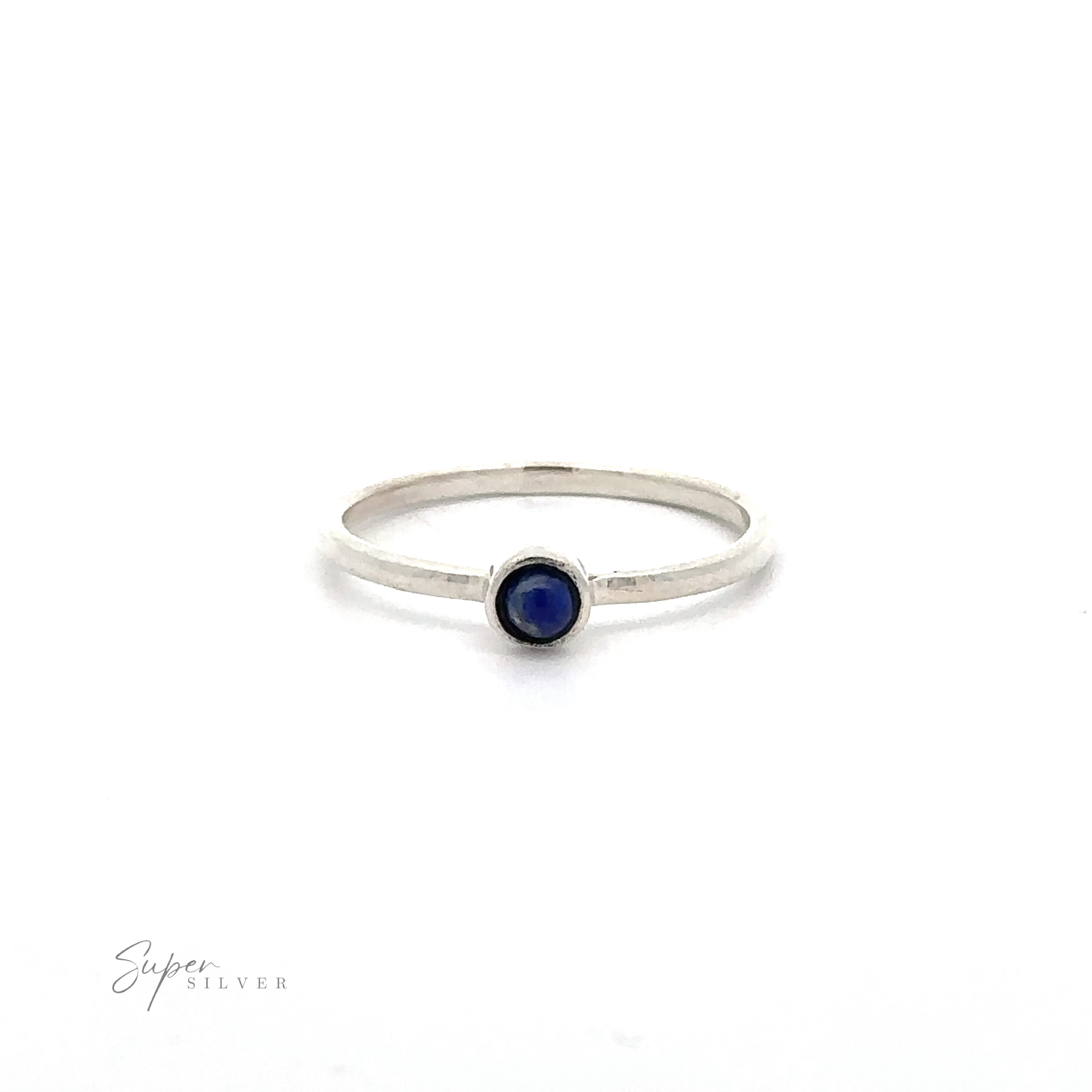 A thin Dainty Stackable Round Gemstone Ring with a small, round, blue gemstone in the center. The brand name "Super Silver" is faintly visible in the bottom left corner. Perfect for those who adore minimalist fashion and stackable rings.