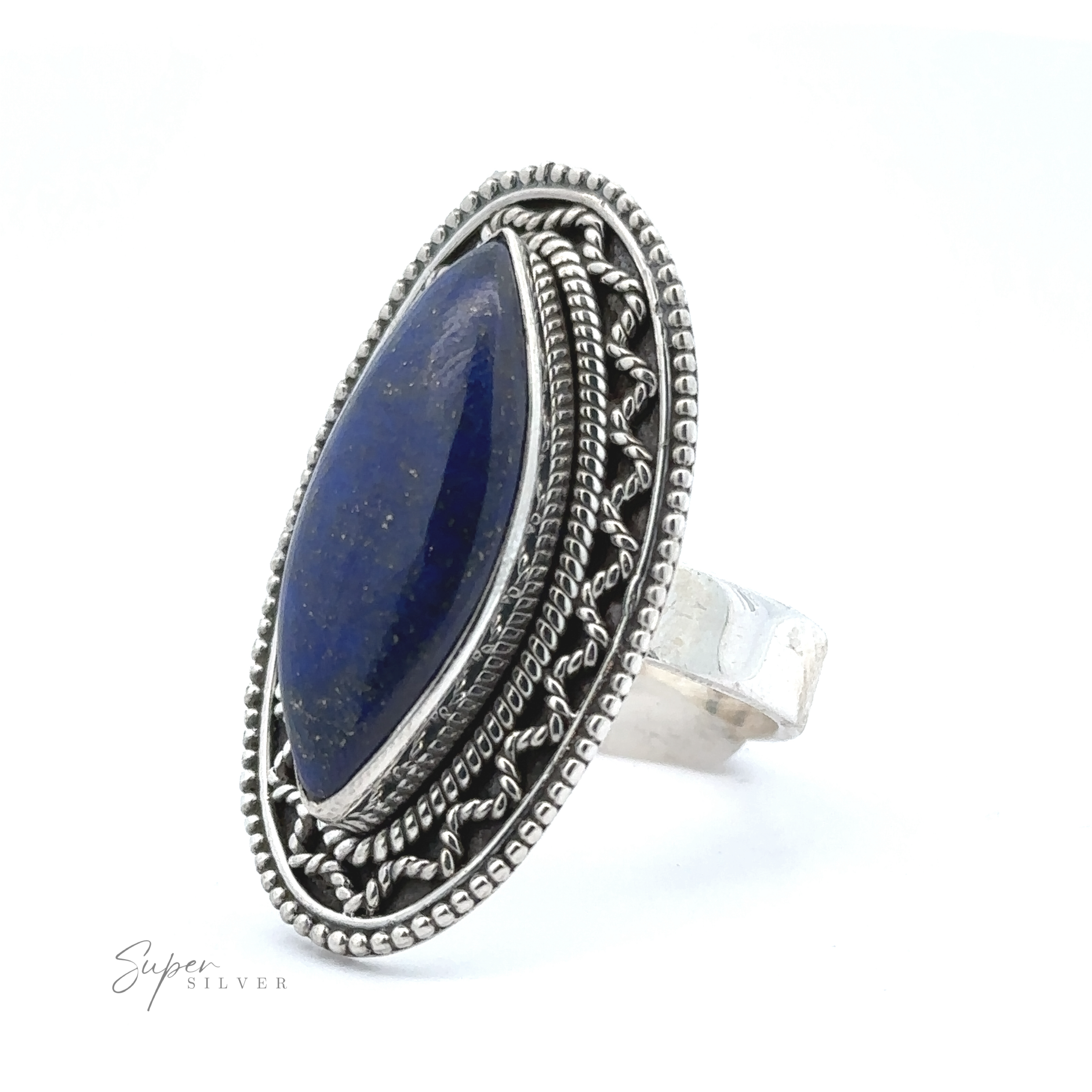 An ornate sterling silver ring featuring an elongated, deep blue stone with decorative metalwork around the setting in a bohemian twist. The words "Marquise Shaped Gemstone Ring With Vintage Shield Border" are visible on the bottom left.