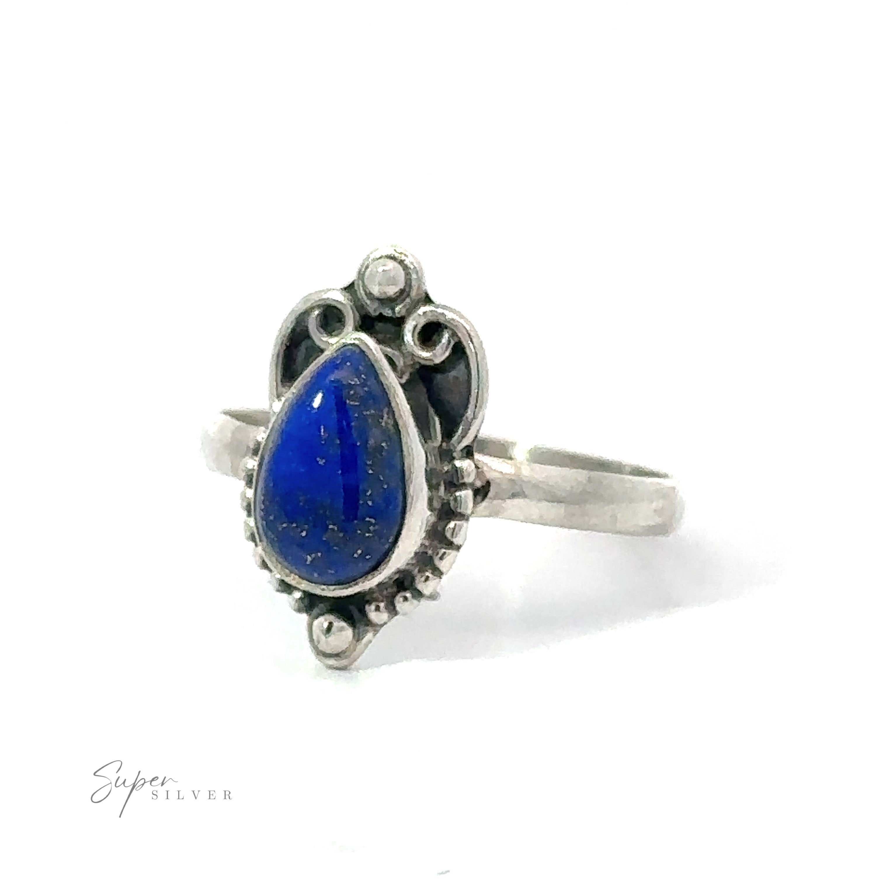 A Vintage Inspired Teardrop Gemstone Ring with a blue lapis lazuli teardrop gemstone set in an ornate, vintage-style mount, displayed against a white background.