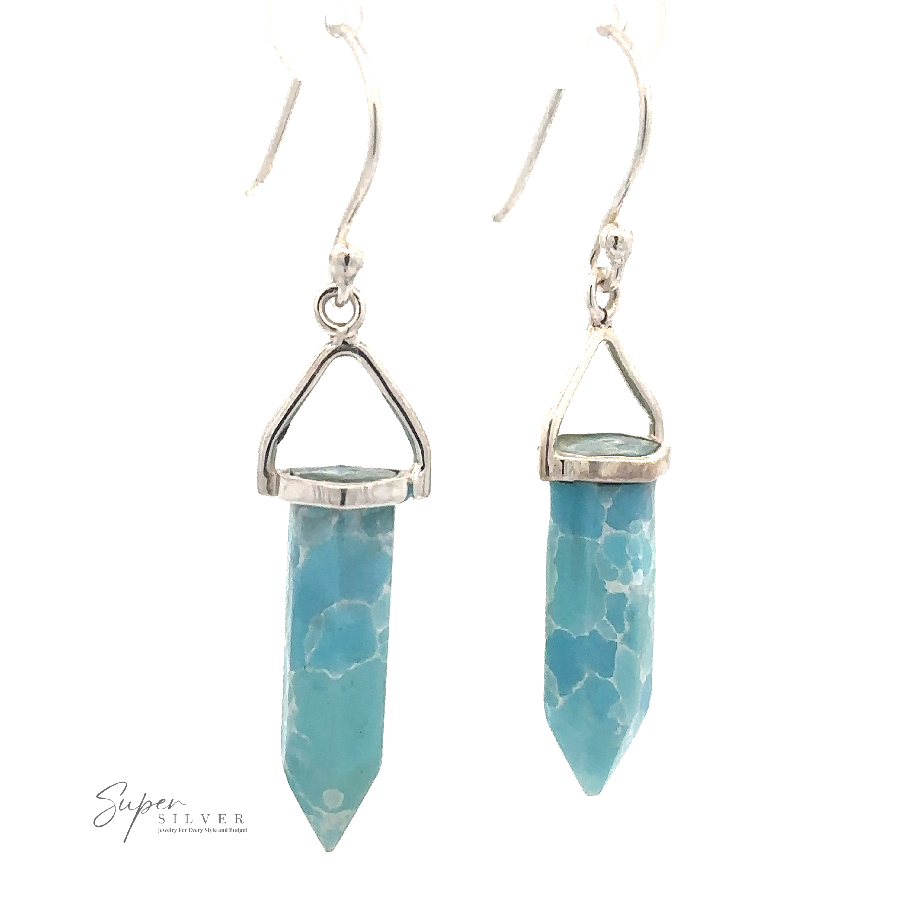 A pair of Obelisk Shape Raw Larimar Earrings with turquoise-colored, hexagonal crystal pendants set in Sterling Silver, hanging from french hooks. The brand logo "Super Silver" is visible on the bottom left.