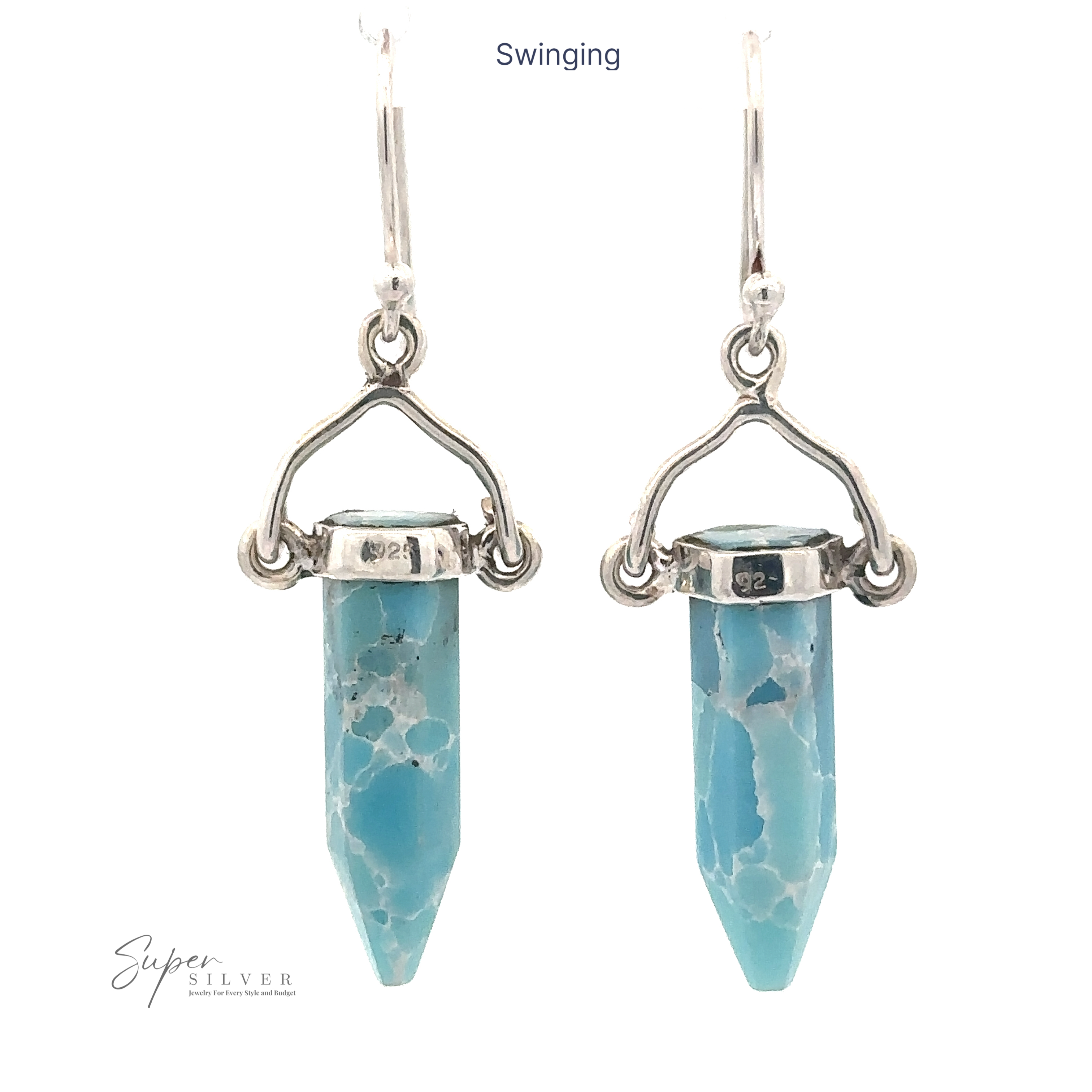 A pair of Obelisk Shape Raw Larimar Earrings featuring turquoise-colored hexagonal crystals set in Sterling Silver hardware with lever-back clasps. The word "Swinging" is written above and the "Super Silver" logo is at the bottom left.