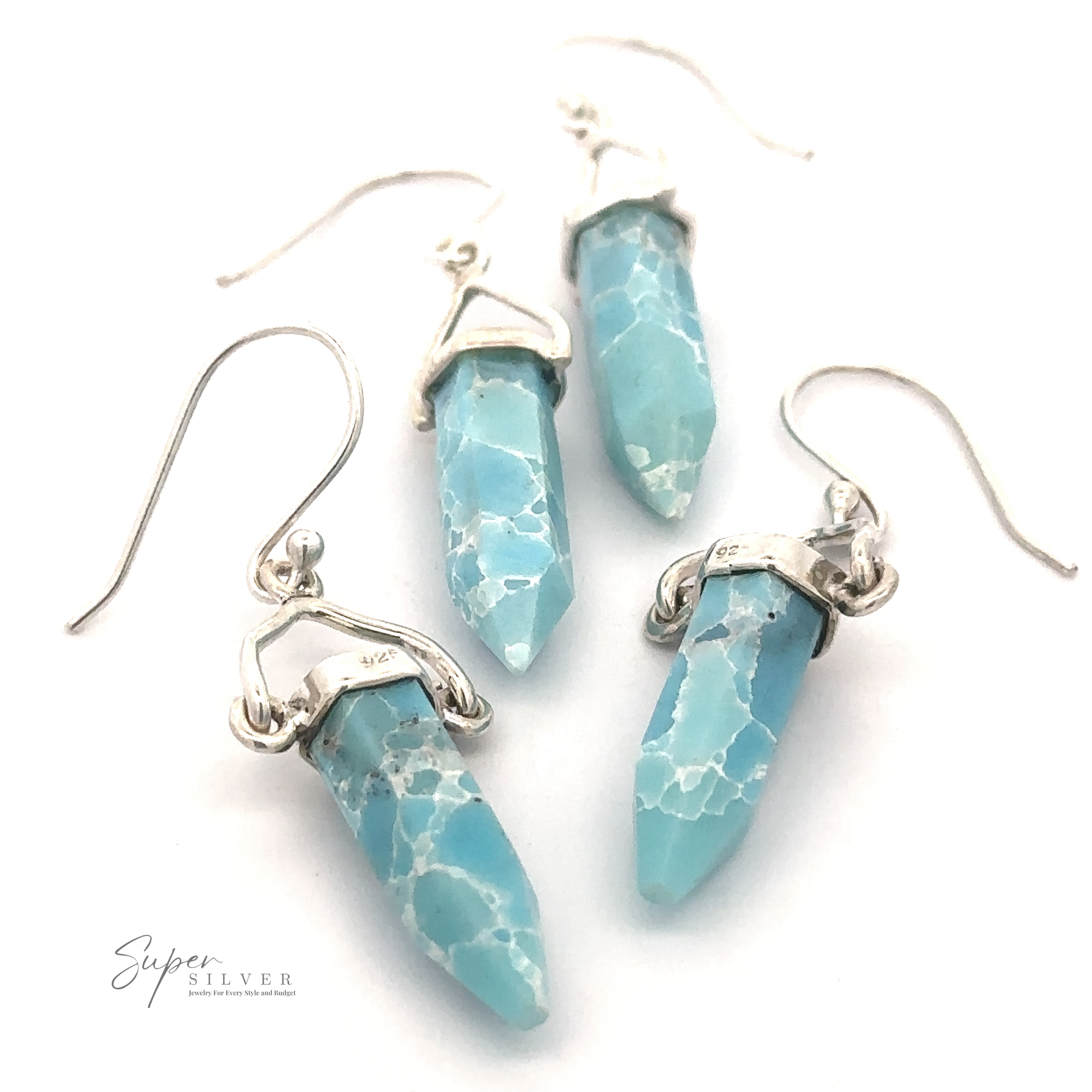 A pair of Obelisk Shape Raw Larimar Earrings in sterling silver settings, displayed on a white background with the "Super Silver" logo in the corner.