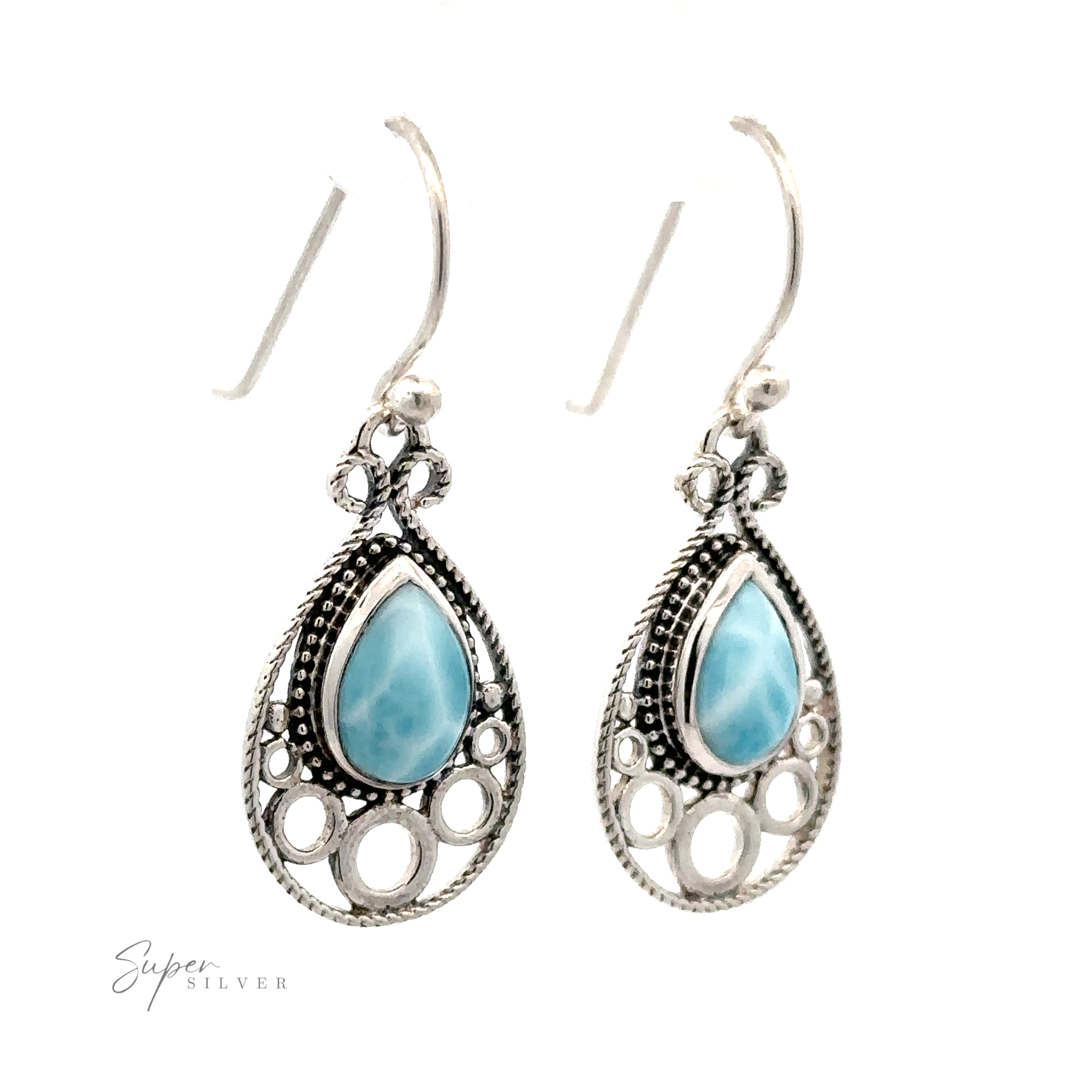 A pair of Teardrop Larimar Earrings featuring intricate designs and blue Larimar stone centers, with hook clasps for easy wearing. The brand "Super Silver" is visible in the lower left corner.