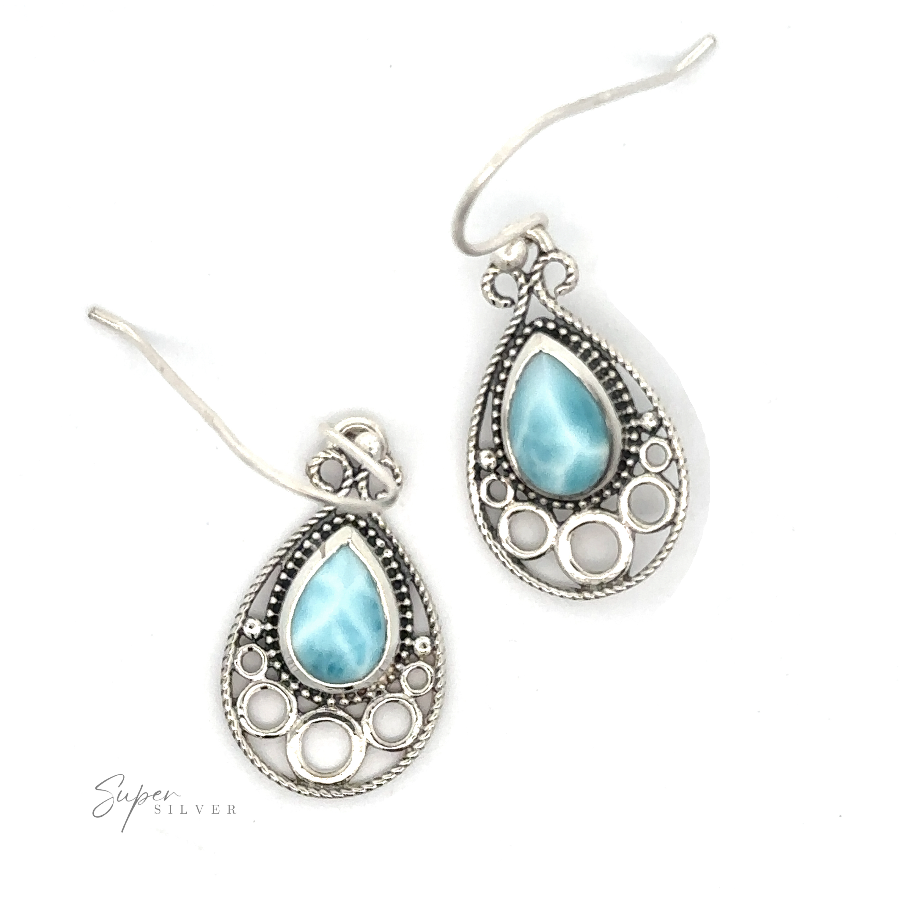 Two ornate Teardrop Larimar Earrings feature enchanting Larimar stone centers and circular cutout designs, set against a plain white background.