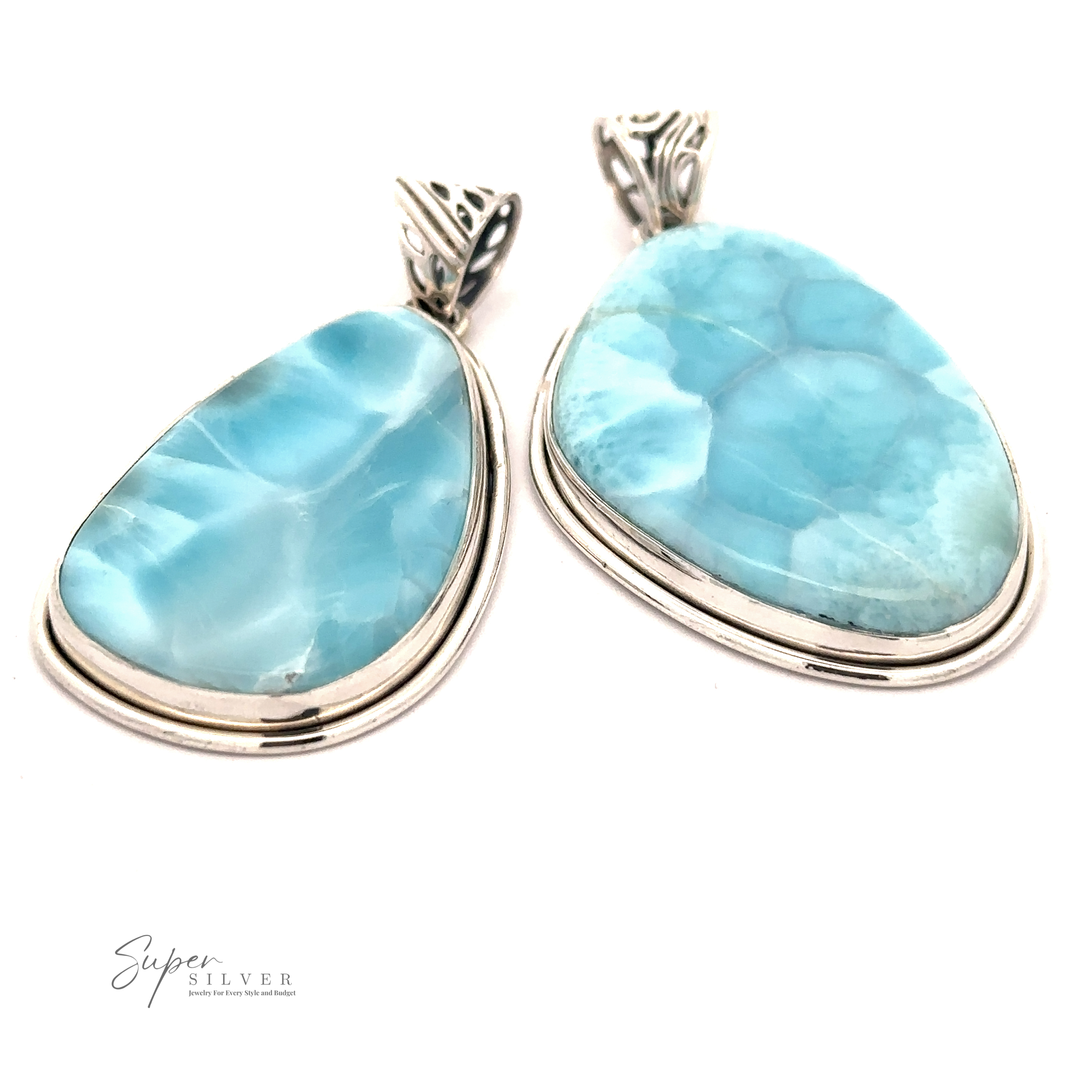 Two elegant Larimar Pendant with Simple Border featuring large, irregularly-shaped Larimar stones, displayed against a white background. Text in the bottom left reads "Super Silver".