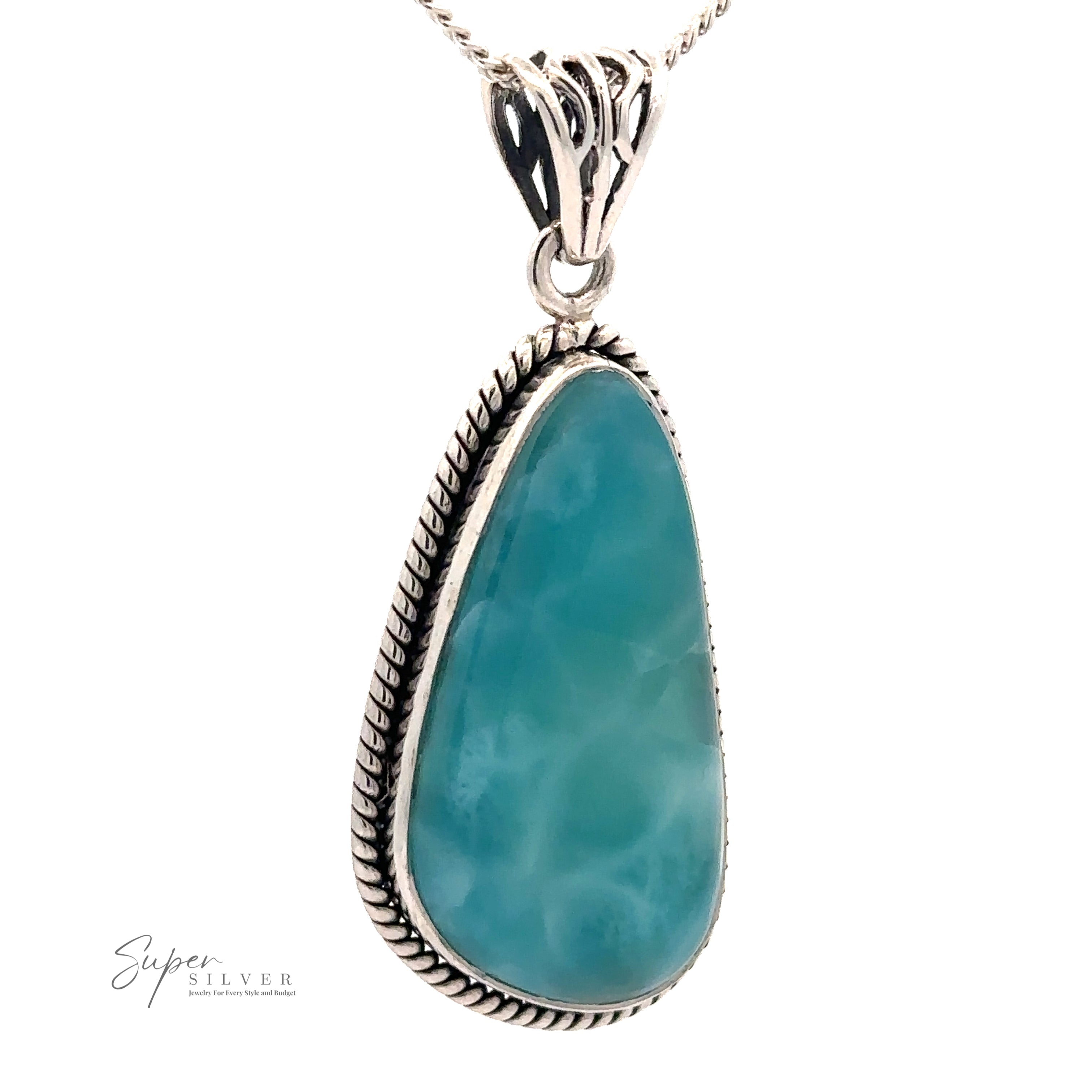 A deep blue Larimar Pendant with Rope Border, encased in an ornate sterling silver setting, hangs on a gleaming silver chain. The text "Super Silver" appears in the bottom left corner.