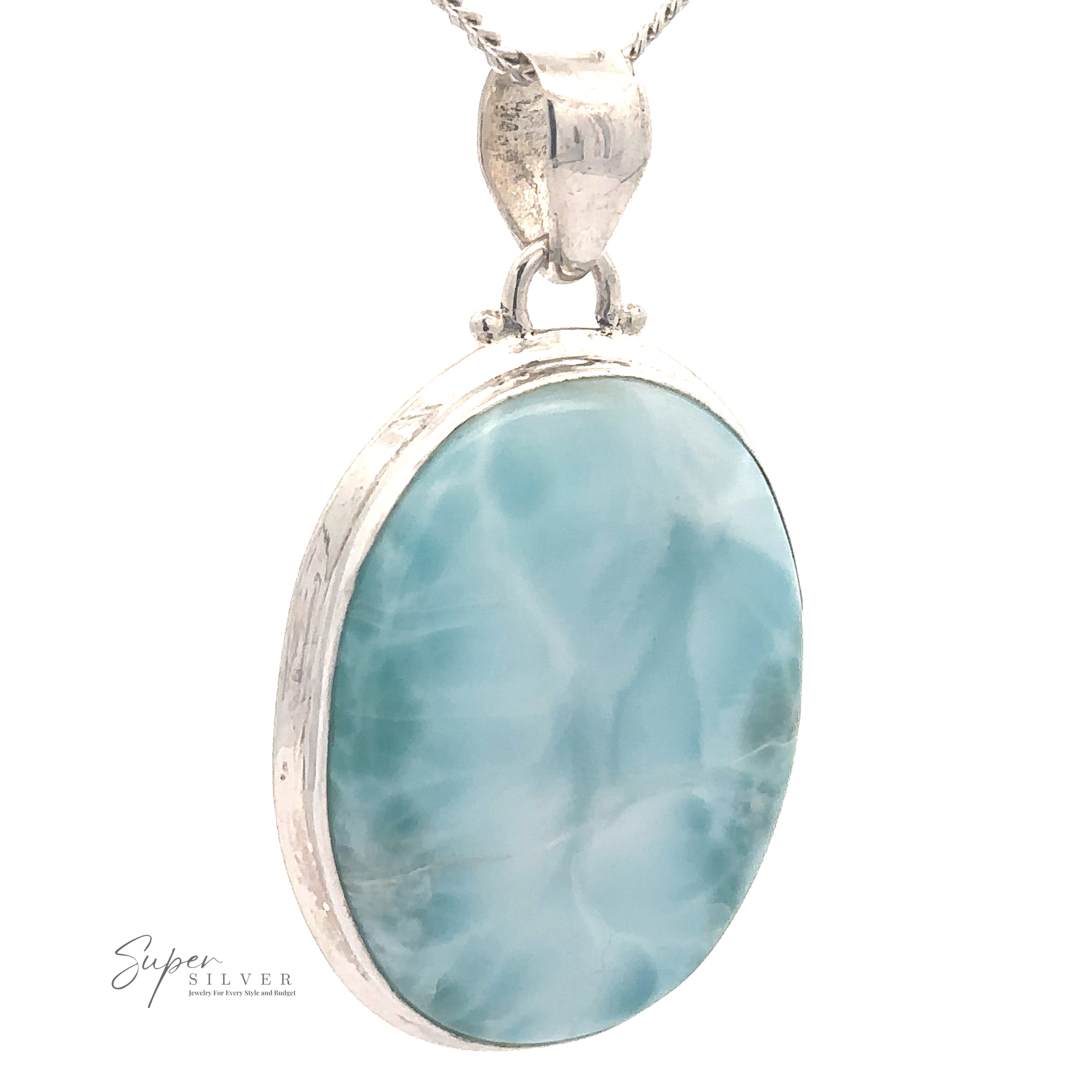 A Simple Oval Larimar Pendant featuring an oval-shaped larimar stone set in a silver bezel, suspended from a silver chain. The stone exhibits a soft blue color with natural white marbling. Perfect as an everyday wear pendant. Text reads "Super Silver.