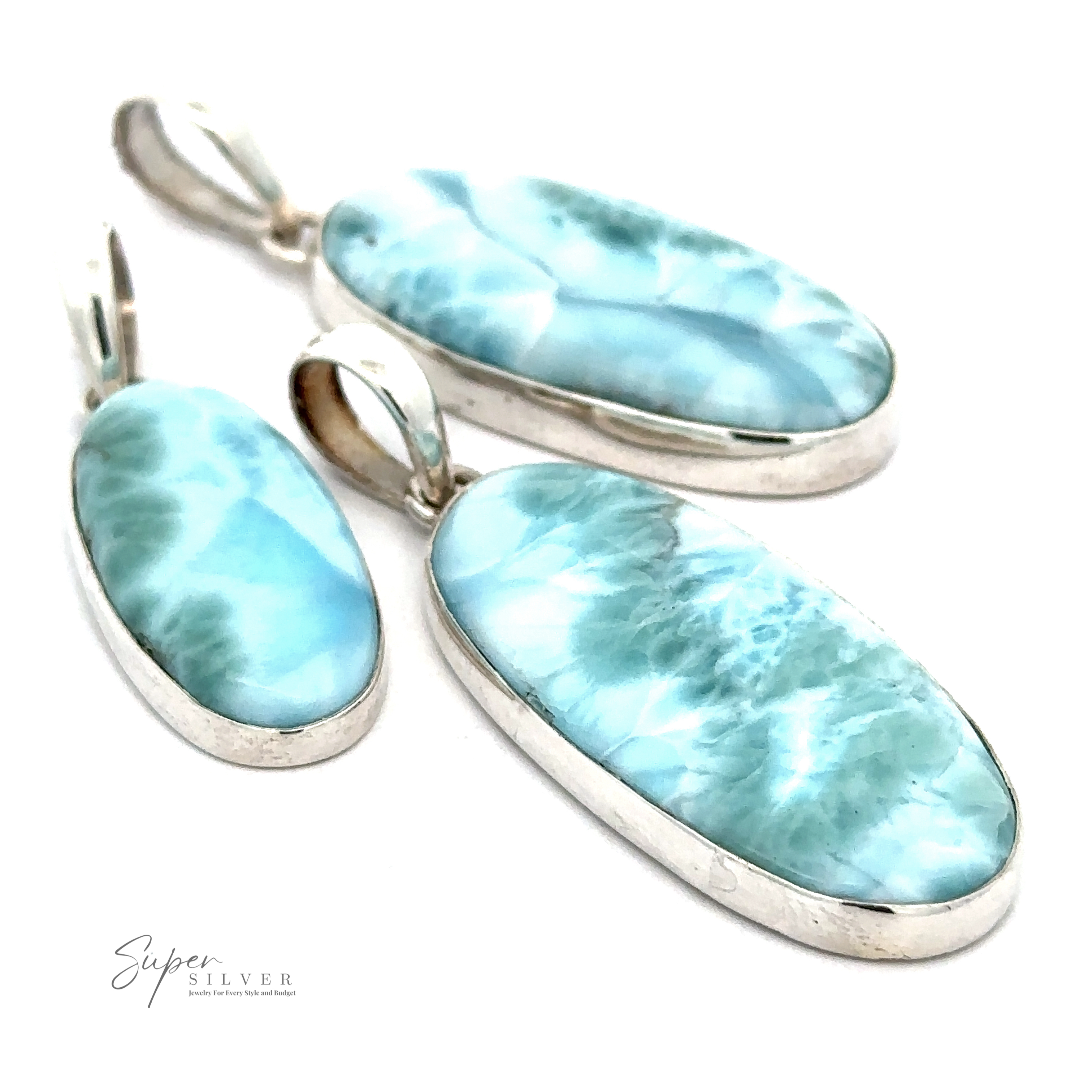 Three Beautiful Long Oval Larimar Pendants of varying sizes with .925 Sterling Silver settings and light blue, patterned stones from the Dominican Republic.