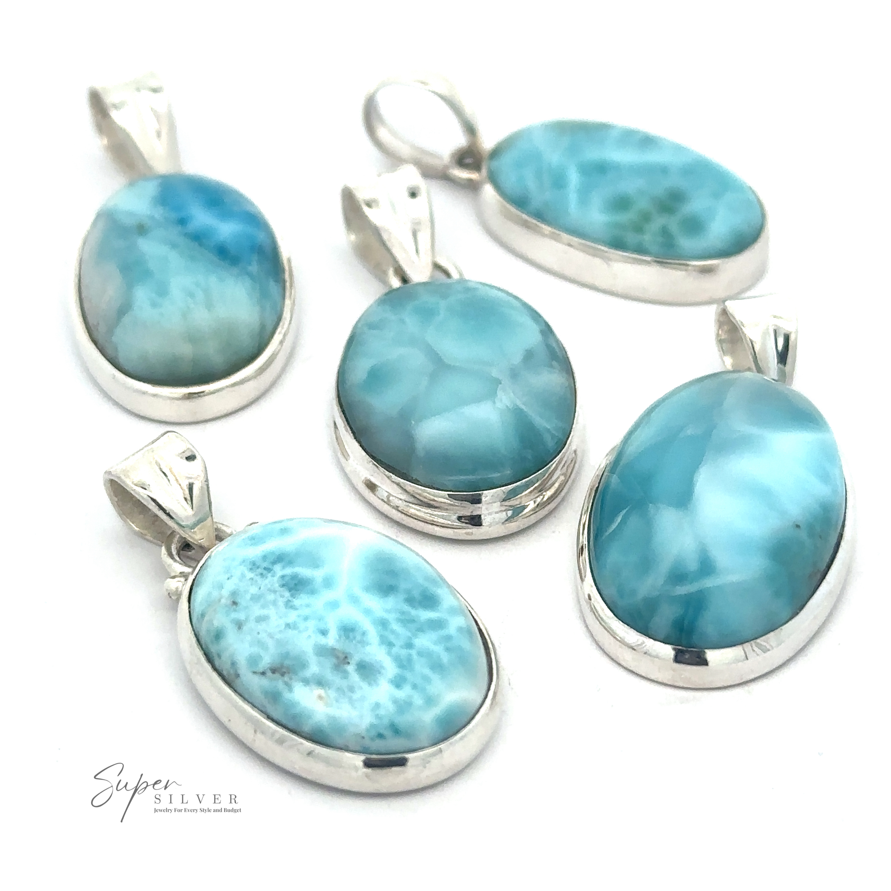 Five Small Oval Larimar Pendants feature blue and white marbled Larimar stones, arranged on a white background. Perfect for everyday wear.