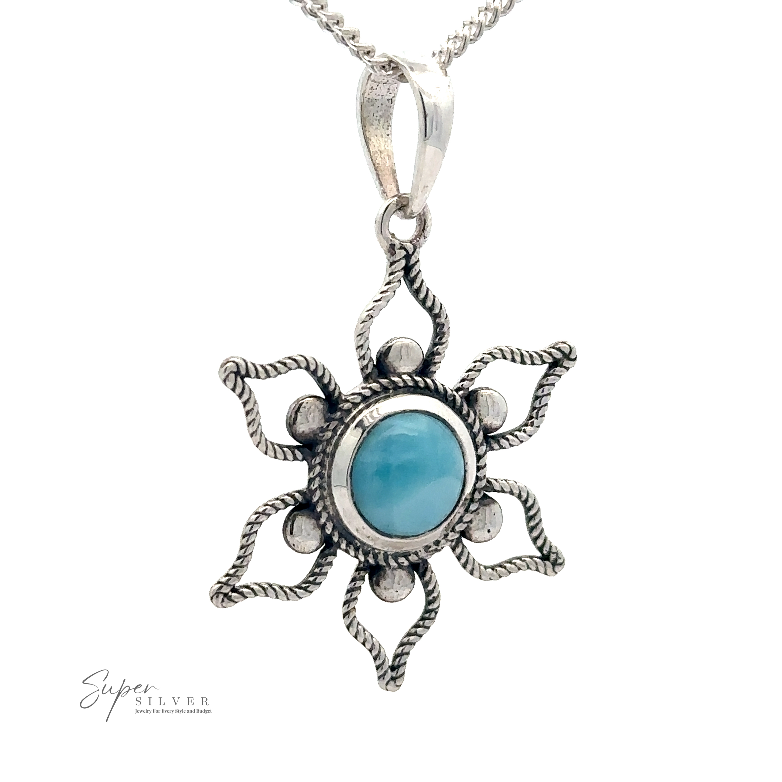 A sterling silver pendant shaped like a sun with wavy rays and a central Larimar stone, reminiscent of a serene beach day, hanging from a silver chain, is replaced by the Larimar Flower Pendant.