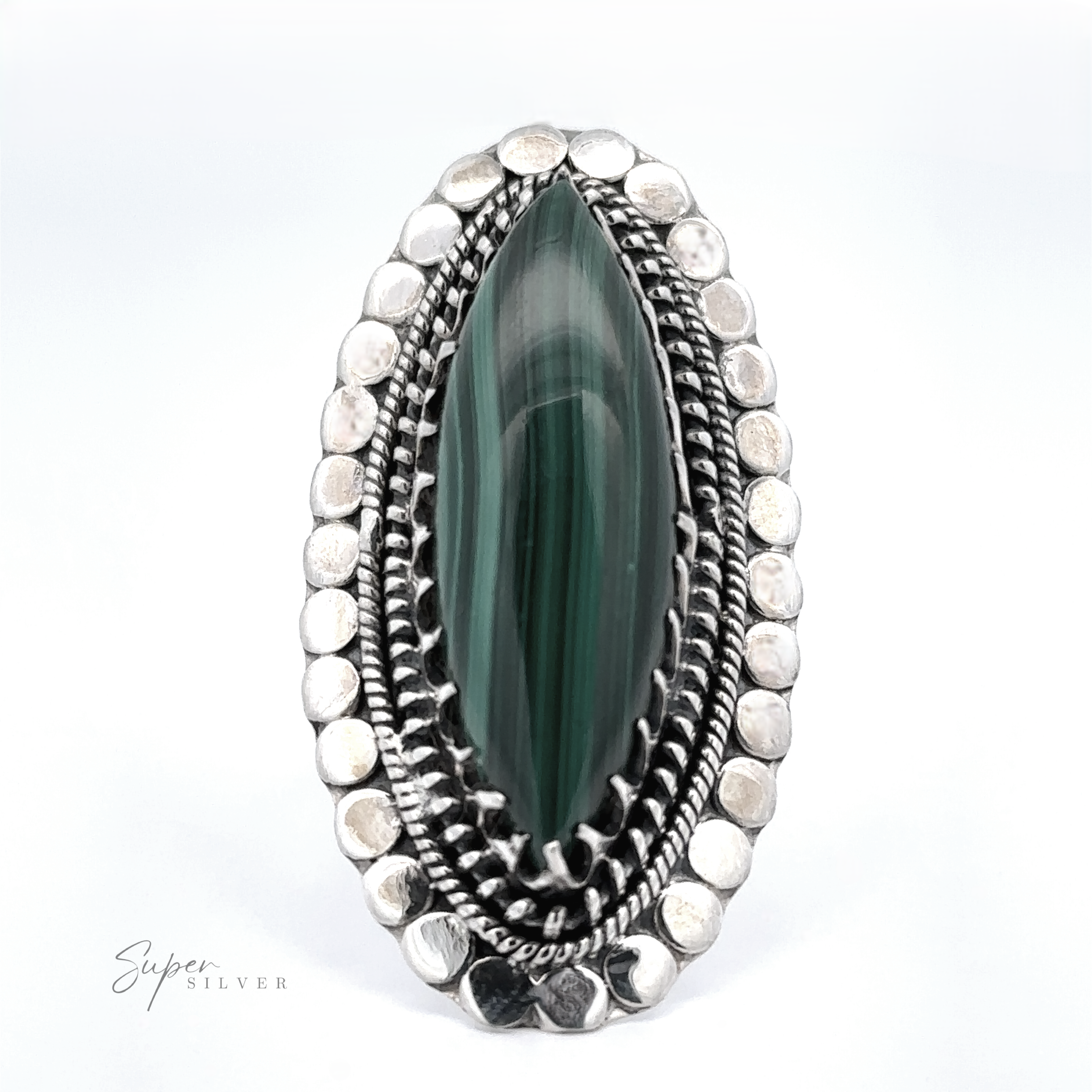 Oval-shaped silver ring with a large, green stone in the center, surrounded by multiple layers of detailed silverwork. The brand name "Super Silver" appears in small text at the bottom left. This exquisite piece is a perfect example of bohemian jewelry at its finest.
Statement Marquise Shaped Gemstone Ring