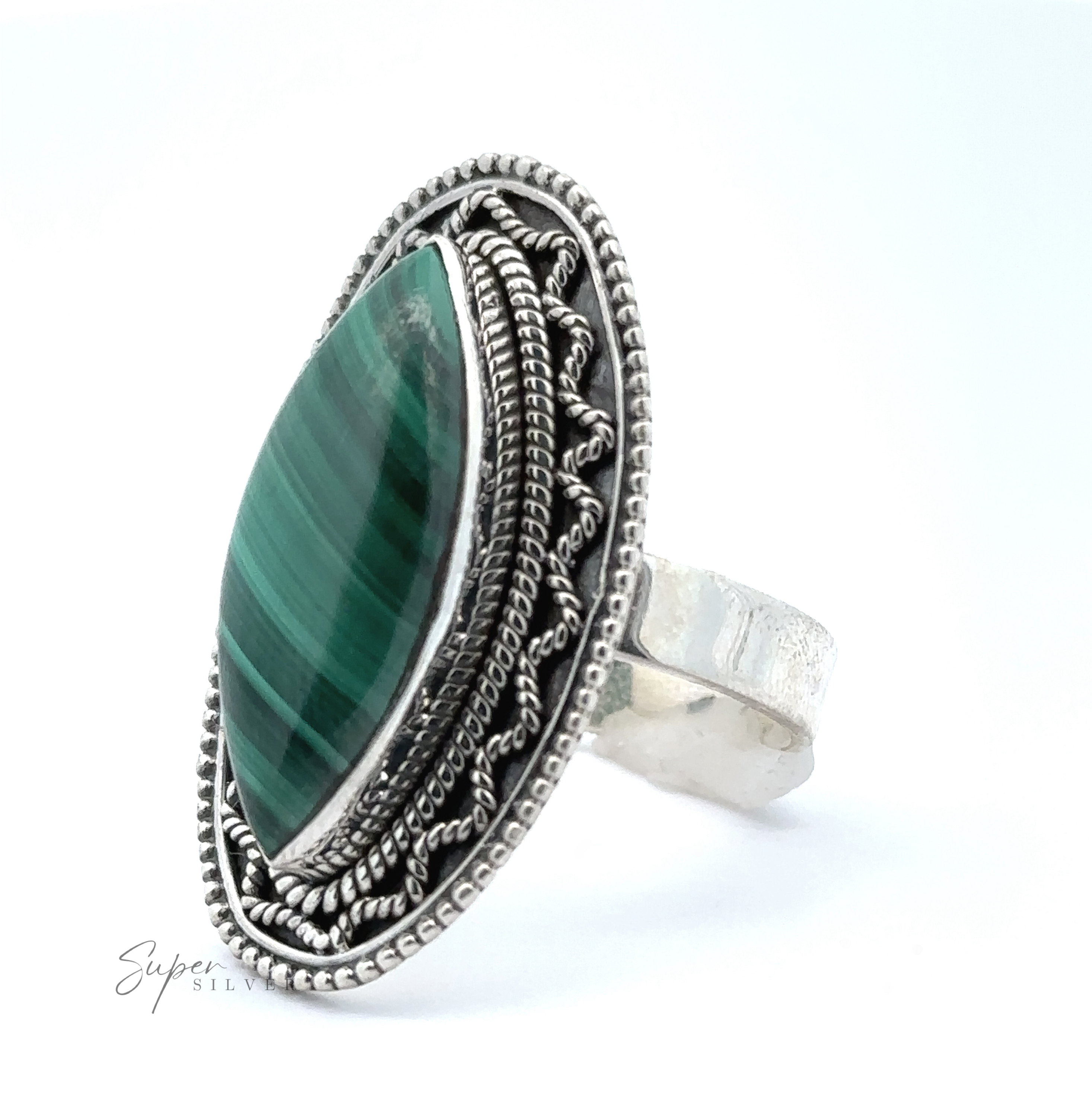 Marquise Shaped Gemstone Ring With Vintage Shield Border with intricate detailing, featuring a large marquise-cut green stone in the center, giving it a Bohemian twist.