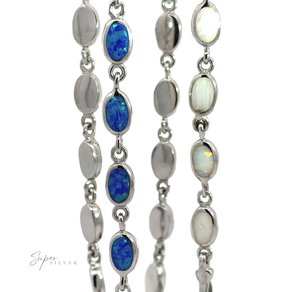 A set of two Simple Oval Link Opal Bracelets, one with blue opal insets and the other with white opal insets, displayed against a white background.