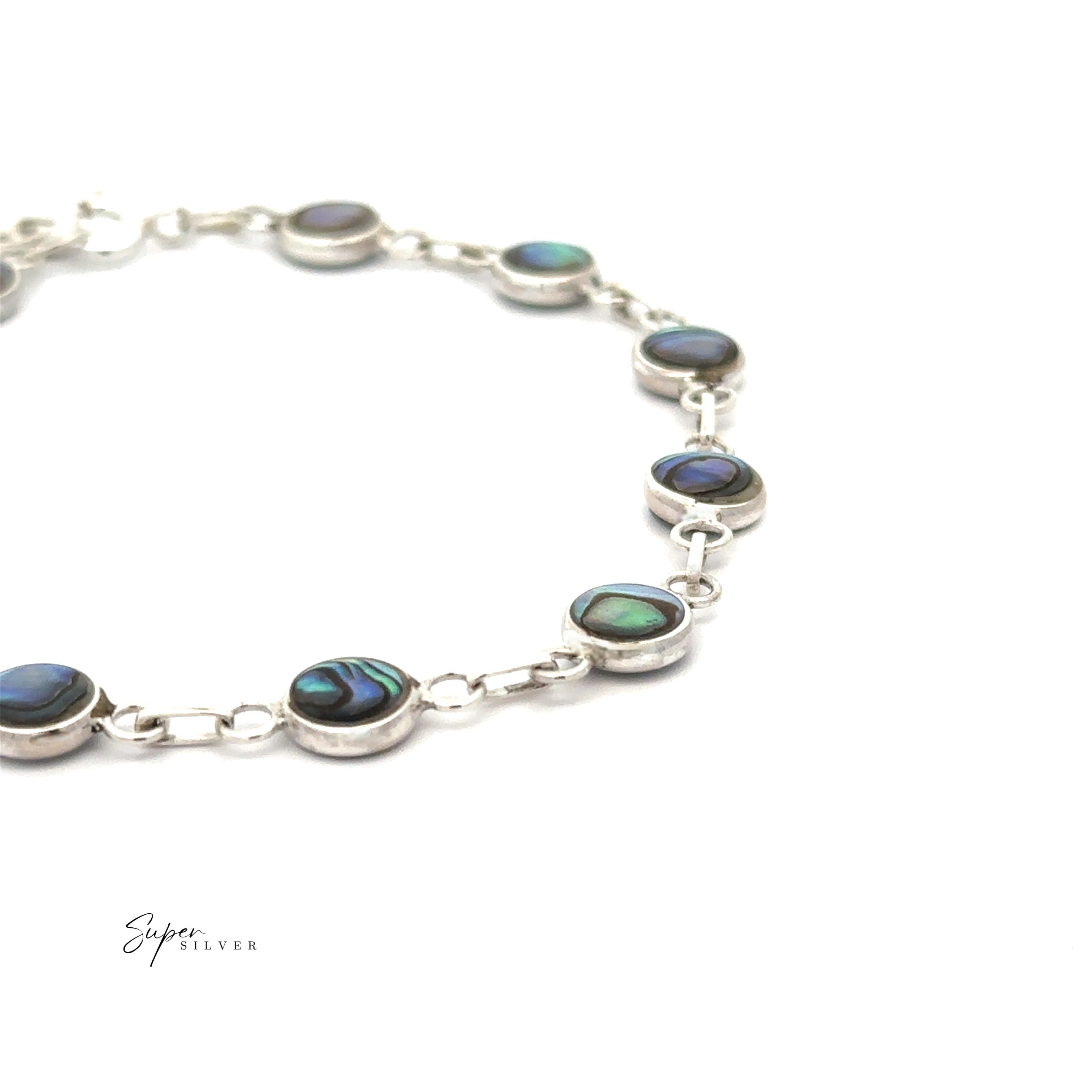 The Reversible Round Inlay Stone Bracelet features silver links with round abalone and mother of pearl inlays, creating a simple, elegant design. Shown on a white background.