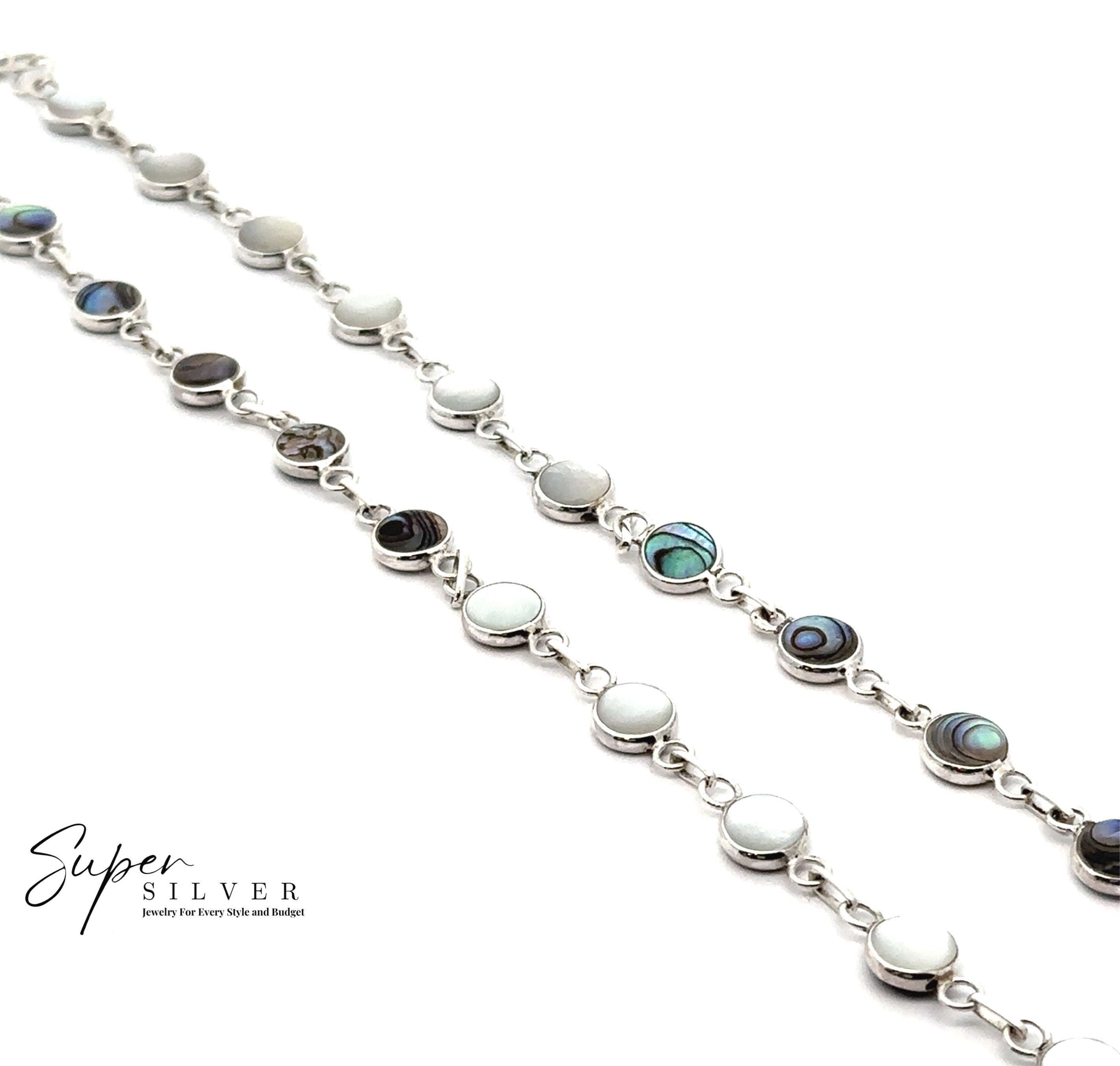 The Reversible Round Inlay Stone Bracelet features round bezel-set stones in white Mother of Pearl and abalone, displayed on a white background with the “Super Silver” logo in the corner.