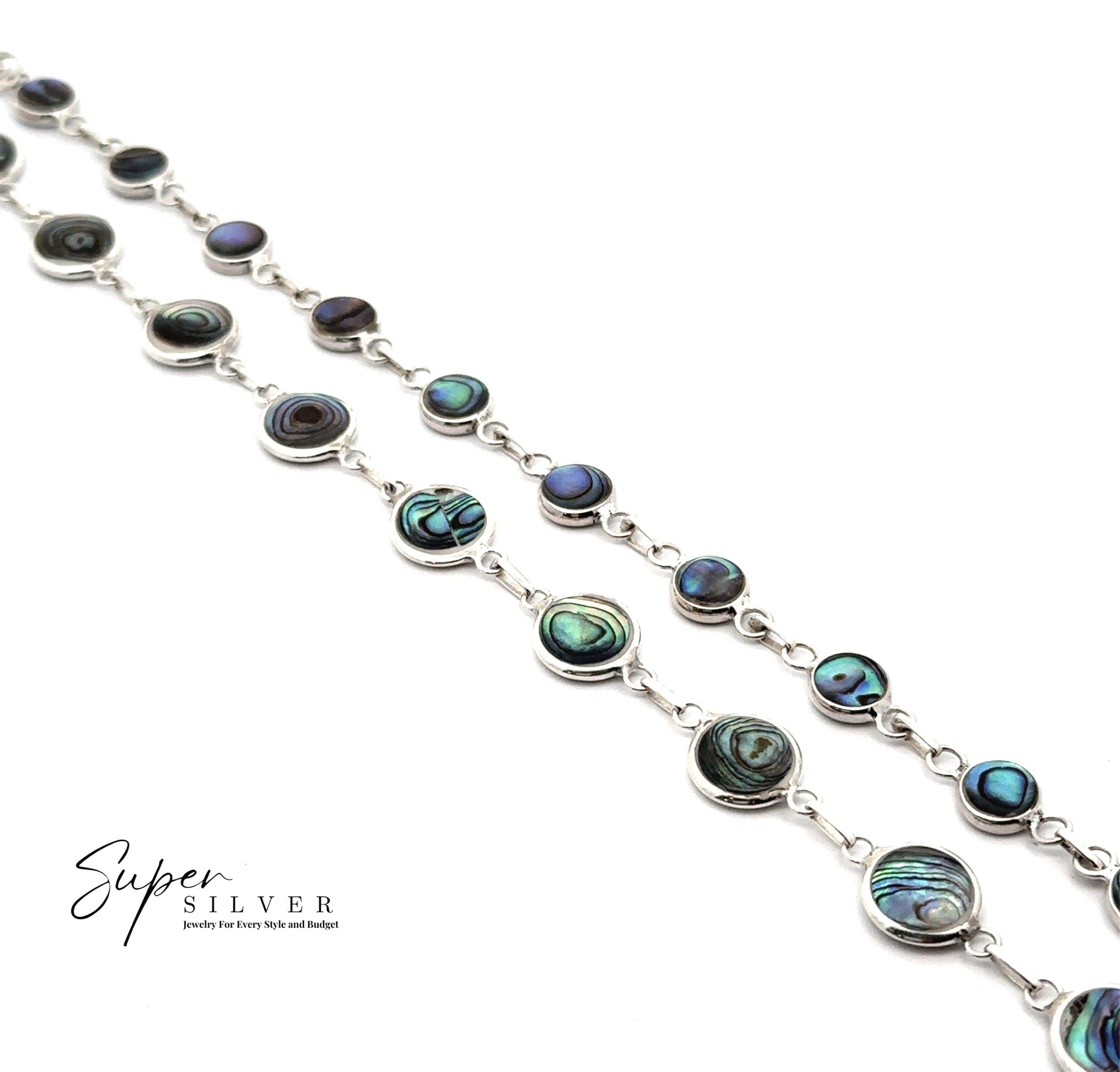 Two Reversible Round Inlay Stone Bracelets with abalone shell and mother of pearl inlays are displayed diagonally on a white background, featuring the Super Silver logo in the bottom left corner.