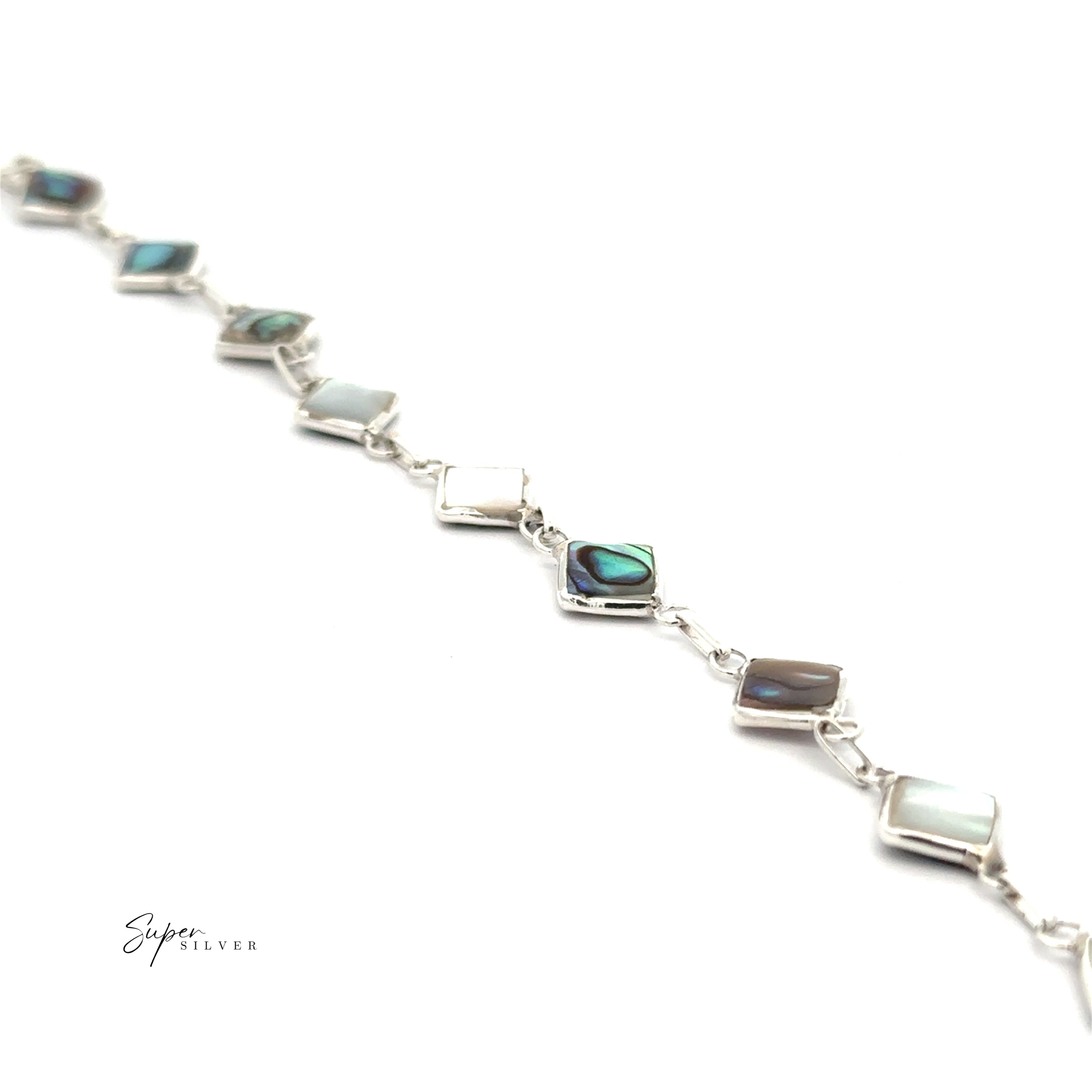The Reversible Diamond Shaped Inlay Stone Bracelet in sterling silver features square abalone shell and mother-of-pearl inlays, displayed diagonally on a white background—an elegant choice for your Abalone Jewelry collection.