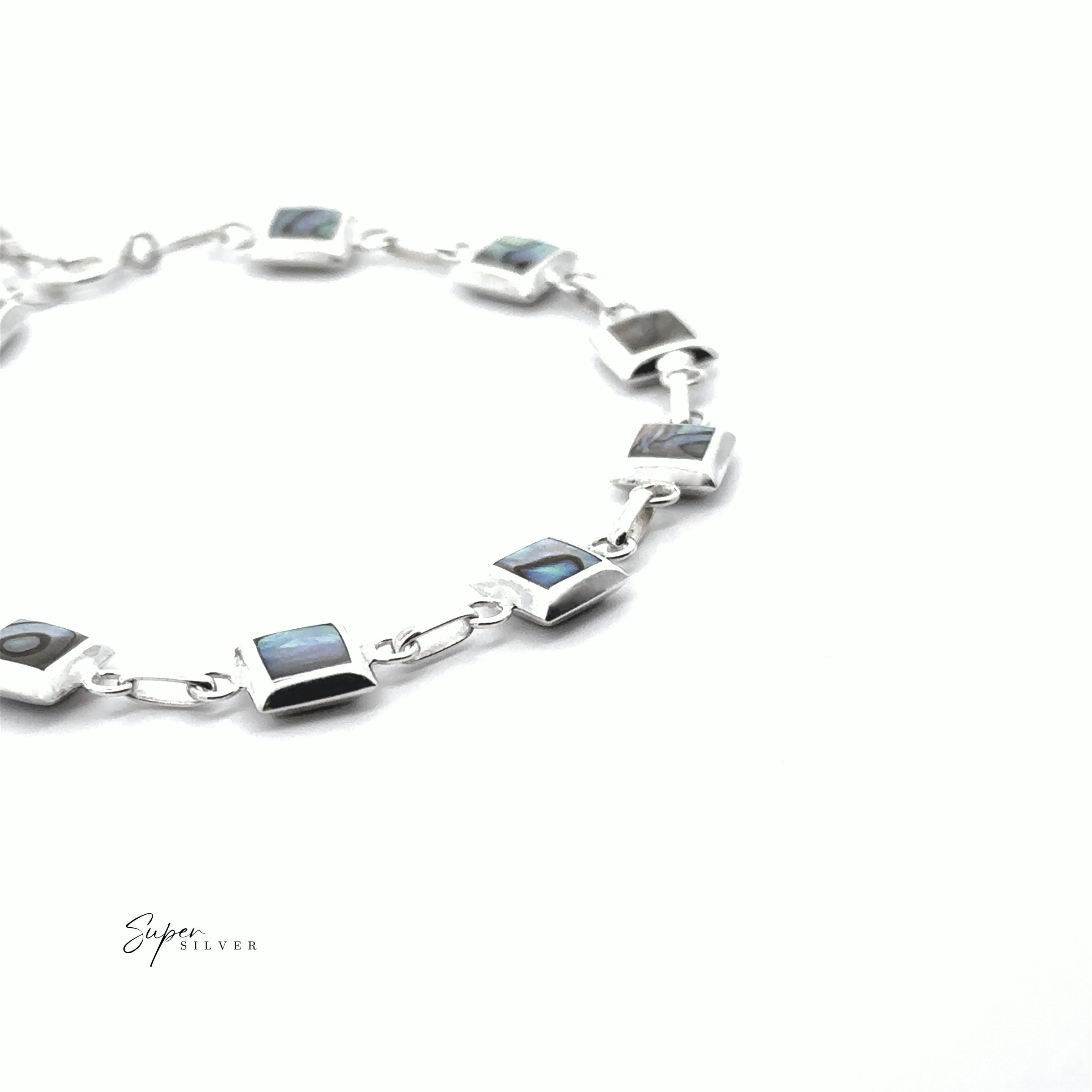 Reversable Square Stone Inlay Bracelet shown on a white background, featuring linked squares with stone inlays. The words "Super Silver" appear in the lower left corner.